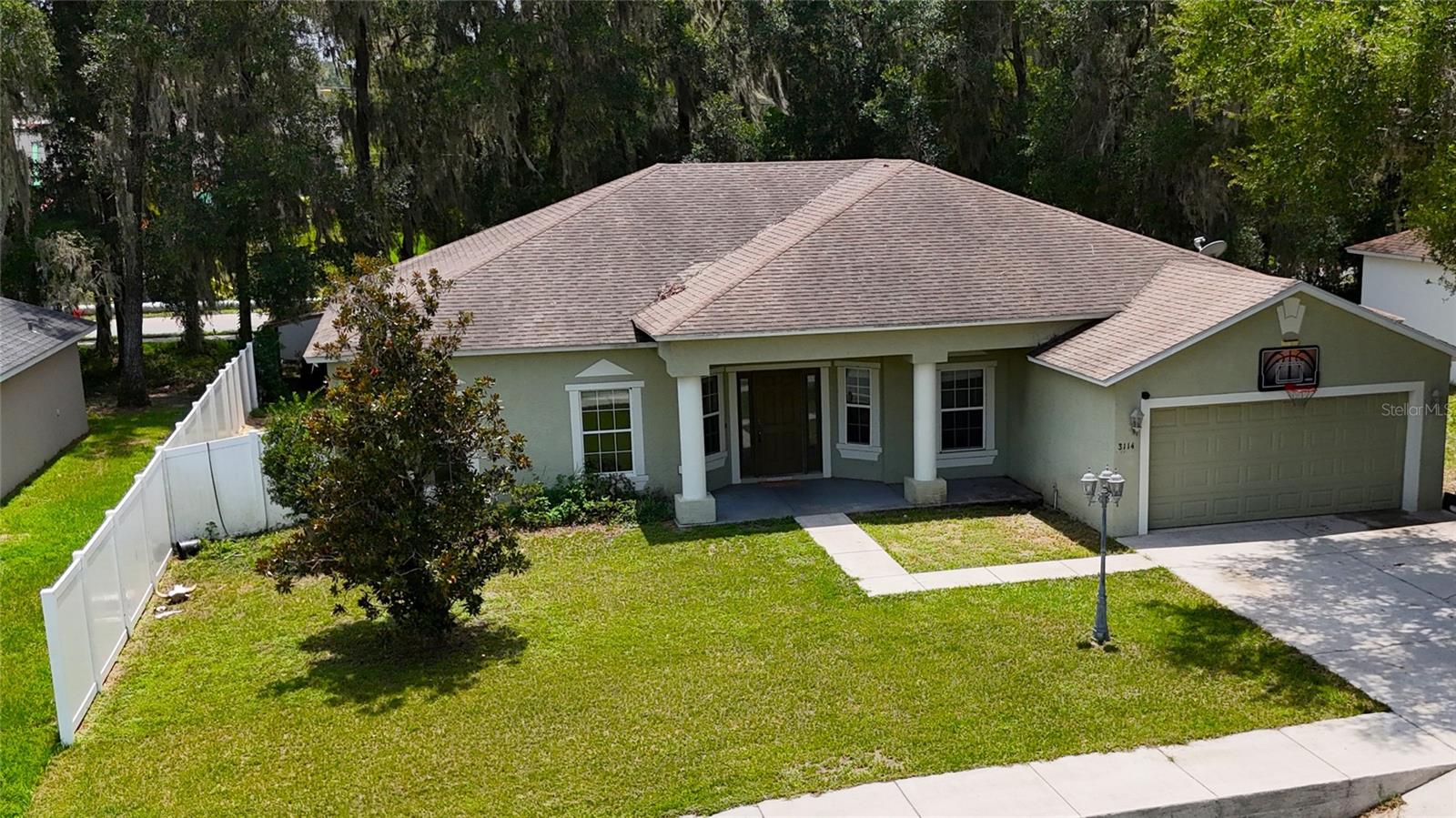 WHAT A GREAT PROPERTY!! 4 BEDROOMS WITH A TRIPLE SPLIT PLAN FOR PRIVACY PLUS A DESIGNATED OFFICE AND FORMAL DINING!! AS YOU APPROACH THE WIDE FRONT PORCH YOU WILL NOTICE THE FRONT DOOR WITH SIDE LIGHTS THAT OPENS ONTO THE FOYER. HOME FEATURES LARGE ROOMS INCLUDING A 20 X 23 LIVING ROOM WITH LVP FLOORING, PROJECTION SYSTEM, VAULTED CEILINGS AND GLASS SLIDERS LEADING TO ROUGHLY 9 X 24 SCREEN ENCLOSED LANAI AND THEN ON TO FENCED YARD. KITCHEN HAS ABUNDANT STORAGE AND COUNTERTOPS INCLUDING AN EAT AT BAR PLUS PANTRY AND A BREAKFAST NOOK WITH STORAGE OVERLOOKING THE BACKYARD. INSIDE LAUNDRY WITH EXTRA STORAGE SHELVING IS LOCATED BETWEEN THE KITCHEN AND THE 2 CAR GARAGE. STEPS FROM THE KITCHEN IS THE FORMAL DINING AREA AND ACROSS THE FRONT FOYER IS A DEDICATED OFFICE WITH FROSTED DOORS. TWO REAR BEDROOMS SHARE A BATH WITH LANAI ACCESS…PERFECT SHOULD YOU CHOOSE TO ADD A POOL! FRONT BEDROOM IS JUST OFF THE LIVING ROOM WHILE 14 X 16 PRIMARY BEDROOM IS ON THE OPPOSITE SIDE OF THE HOME. PRIMARY BATH FEATURES SEPARATE STEP IN SHOWER AND A SOAKING TUB PLUS A WALK IN CLOSET. THERE IS ALSO ACCESS TO THE LANAI AND BACKYARD FROM THIS BEDROOM THROUGH GLASS SLIDERS. ALL LOCATED ON A CUL-DE-SAC WITH A VINYL PRIVACY FENCED YARD WITH STORAGE BUILDING TOO!!