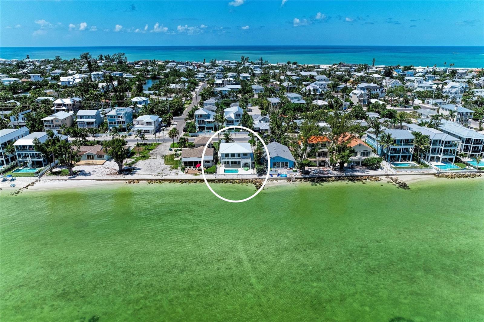 One or more photo(s) has been virtually staged. Price reduced — dramatic value on Anna Maria Island! This rare north-end bayfront home offers nearly 3,000 sq ft under air with 4 bedrooms, 3 baths, a private pool and panoramic Tampa Bay views including the Sunshine Skyway Bridge. Step through the white picket fence into updated, open-concept living with high ceilings, light wood-look laminate flooring and 8-foot sliding doors that frame the water and lead to a screened porch and oversized bayfront deck — ideal for entertaining or sunrise views. The newly updated eat-in kitchen features quartz counters, stainless appliances and white shaker cabinets. Two guest bedrooms and a full bath are on the main level, with a one-car garage that accommodates a golf cart and beach gear. Upstairs are two spacious primary suites, each with en-suite baths, sitting areas and private deck access overlooking the bay, plus a den/sitting room with gorgeous water vistas. Whether you’re seeking full-time island living, a family beach retreat, or a vacation rental investment, this home pairs prime bayfront location, modern updates, a private pool and unmatched views — where else will you find this combination at this price? One or more photos have been virtually staged.
Note: Property information received from third-party sources is considered reliable but is not guaranteed.  All information should be independently verified by buyers and buyers' agent.