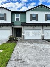 Welcome to your brand new home in the desirable Magnolia Reserve community of Ocoee. This stunning 2025 built townhome combines modern comfort and elegant finishes. As you step inside to an open-concept main floor, featuring bright natural light and a spacious living and dining area. Upstairs you'll find a versatile loft area, ideal for a cozy media space. Located just minutes away from SR 429, shopping, dining and top-rated schools. Don't miss this opportunity!