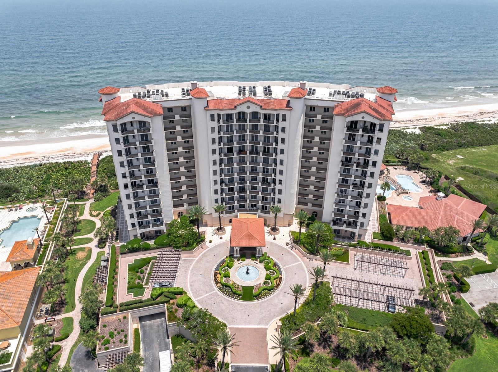 Wake up each morning to breathtaking Atlantic sunrises and the soothing rhythm of the ocean from this exceptional direct oceanfront residence in the exclusive Tuscany Condominium at Hammock Dunes. Available for late September occupancy, this beautifully remodeled and thoughtfully upgraded luxurious fifth-floor home offers 2,110 square feet of elegant coastal living with panoramic ocean views that create an unforgettable backdrop from sunrise to sunset.
Arrive in style via your private elevator, providing secure access directly into your private foyer. Inside, soaring 10-foot ceilings, expansive windows, and an open-concept design flood the home with natural light while perfectly framing the endless blue horizon. Sliding glass doors from both the living areas and the spacious primary suite invite you onto the expansive balcony, where sea breezes and spectacular views become part of your daily routine.
Designed for both entertaining and everyday living, the gourmet kitchen showcases custom cabinetry, custom Granite Honed Absolute Black countertop, premium stainless steel appliances, a Sub-Zero refrigerator, farmhouse sink, and abundant workspace for preparing meals while remaining connected to family and guests. Every detail has been carefully selected to create an inviting atmosphere that blends timeless elegance with modern coastal style.
The versatile floor plan includes three generous bedrooms plus an additional bonus room ideal as a fourth bedroom, executive office, den, or hobby space. Two-and-a-half beautifully finished bathrooms complement the home's design. Beautiful Santini Pompei Honed Quartz counters in the primary bathroom.  Luxury vinyl plank flooring enhances the bedroom spaces, while valuable upgrades—including a Flo-Logic water protection system, pet wash station in the utility room, new water heater in 2025, updated HVAC system, and private storage area—add convenience and lasting value.  Tuscany residents enjoy an exceptional collection of resort-inspired amenities designed to elevate everyday living. Relax beside the oceanfront pool and spa, gather with friends at the cabana and grilling area, stay active in the state-of-the-art fitness center, unwind in the sauna or steam room, or entertain in the beautifully appointed club room featuring a full kitchen, bar, and billiards area. An elegant lobby and guest suite provide a warm welcome for residents and visitors alike.
Beyond the building, the area offers an unparalleled coastal lifestyle surrounded by scenic walking and biking trails, and miles of pristine beach. Fine dining, shopping, medical facilities, and daily conveniences are only minutes away, while the rich history of St. Augustine and the attractions of Daytona Beach and Jacksonville are easily accessible.
This extraordinary residence offers far more than a home—it offers an elevated way of life where luxury, comfort, and spectacular oceanfront beauty come together every single day.   Membership in the Platinum rated Hammock Dunes Oceanfront Golf Club is available but not included in this sale. Available for occupancy late September.