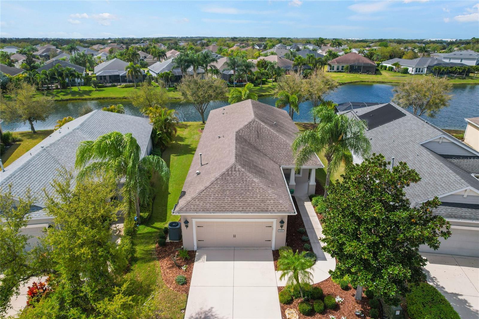 Welcome to 12187 Longview Lake Circle, a beautifully maintained home offering comfort, style, and serene water views in the highly desirable Lakewood Ranch community.  
This spacious residence features 3 bedrooms, 2 baths, and a versatile flex room, perfect for a home office, den, or hobby space.  This home features elegant tile flooring throughout, creating a seamless and low-maintenance living environment.
At the heart of the home is an open-concept kitchen that flows effortlessly into the great room and lanai, making it ideal for entertaining or everyday carefree living.  The kitchen is equipped with upgraded LG appliances, a Bosch dishwasher, and reverse osmosis water system in kitchen offering both style and functionality.  
Thoughtful upgrades enhance the home's comfort and efficiency  including custom Plantation shutters and Hunter Douglas Honeycomb shades.  The exterior was freshly painted two years ago, and a new Trane HVAC heat pump system was installed in 2023, with the balance of a 10-year warranty for added peace of mind.
Step outside to your private lanai, where you can enjoy peaceful mornings with coffee or relaxing evenings overlooking the spectacular shimmering pond, creating a tranquil backdrop for everyday living.
Located in Central Park, this home offers convenient access to shopping, dining, and all that the vibrant Lakewood Ranch lifestyle has to offer.