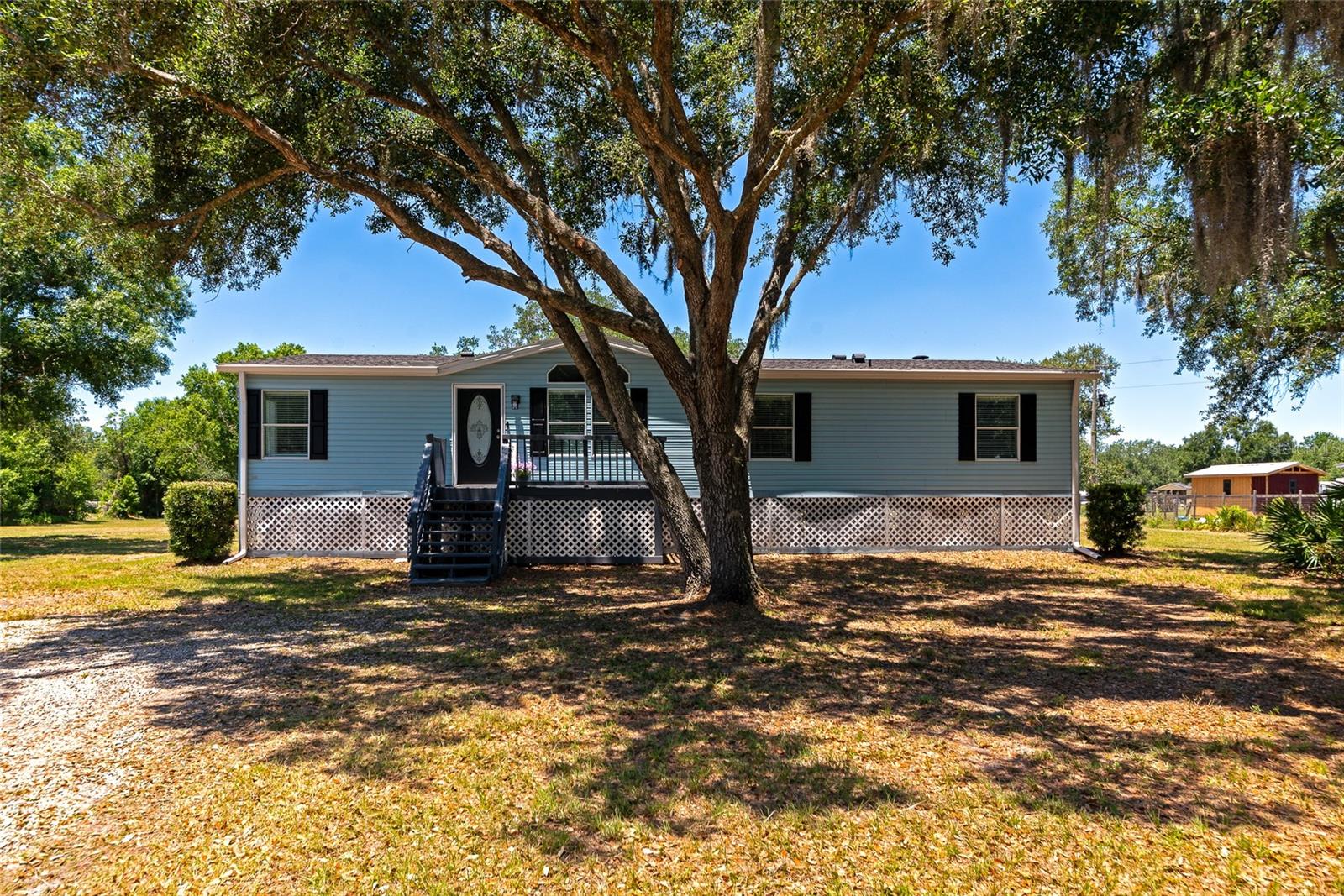 Welcome to your own private slice of country paradise! Situated on 5 beautiful acres and located outside of a flood zone, this fully remodeled and freshly painted move-in ready 3-bedroom, 2-bath manufactured home offers the perfect blend of modern updates and peaceful country living. Enjoy the freedom of NO HOA and NO deed restrictions, making this an ideal horse property, mini farm, homestead, or private rural retreat. Bring your horses, livestock, chickens, RVs, boats, trailers, and work vehicles, there's plenty of open pasture and usable land to make your vision a reality. Step inside to discover a bright open-concept floor plan featuring new luxury vinyl plank (LVP) flooring, updated lighting and ceiling fans, and cordless lift blinds throughout. Major improvements include a NEW ROOF (2024), new vapor barrier, and updated AC ductwork, providing peace of mind for years to come. Outdoor enthusiasts and hobby farmers will appreciate the endless possibilities this property offers. With ample space for horses, livestock, gardening, agricultural use, recreation, equipment storage, and outdoor entertaining, you'll have room to spread out and enjoy the rural lifestyle you've been dreaming of. An RV hookup with 30-amp electric service and water connection is already in place behind the home, making it perfect for guests, travel trailers, or additional flexibility. Whether you're searching for a 5-acre homestead, horse farm, mini ranch, livestock property, or simply a private retreat with room to roam, this versatile property checks all the boxes. Don't miss this rare opportunity to own unrestricted acreage with modern upgrades and endless potential.
Mineral rights do not convey with the property.
