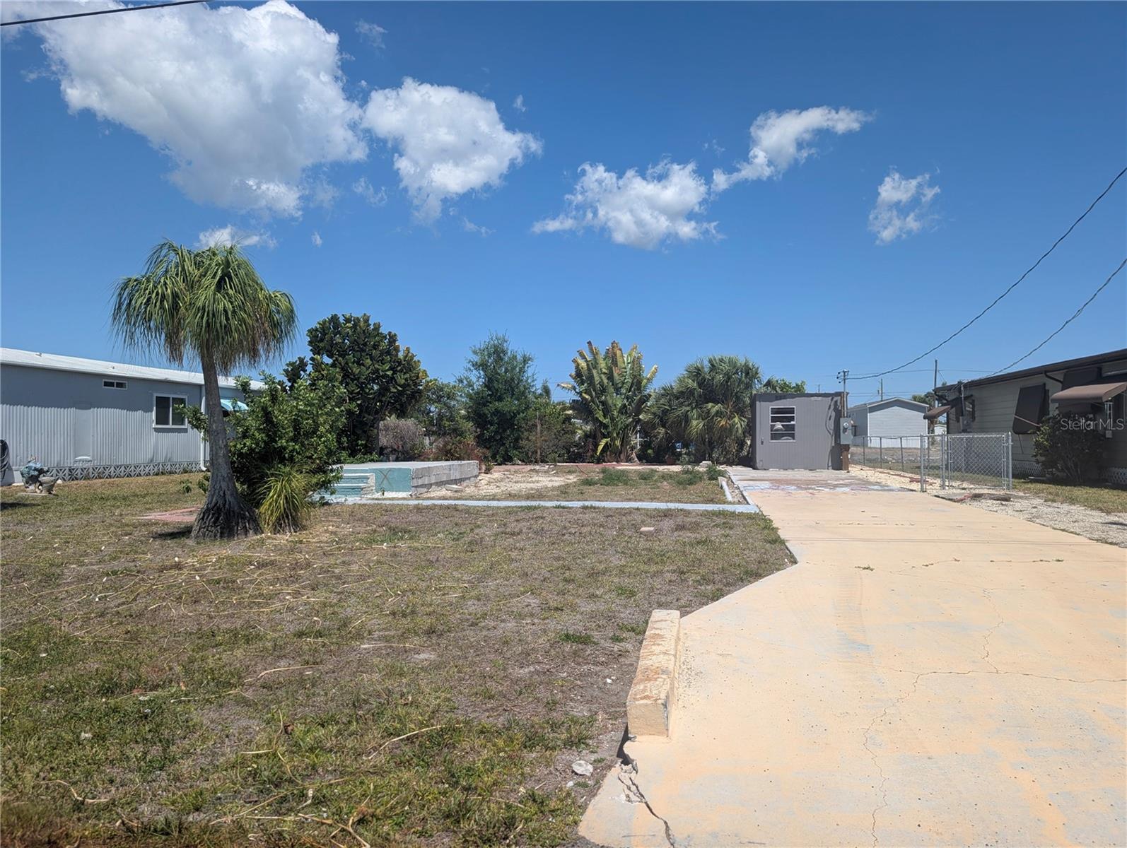 THE SHED THAT IS ON THE PROPERTY CONVEYS WITH SALE AND PLEASE DO NOT USE STAIRS TO DOCK - being repaired.
Go & Show as simple as that! Community now called Manatee Cove formerly Holiday Mobile Estates. All
dimensions are approximate.  All information deemed reliable.  Buyer and Agent to verify to their own
satisfaction. Boat lift capacity is being confirmed!