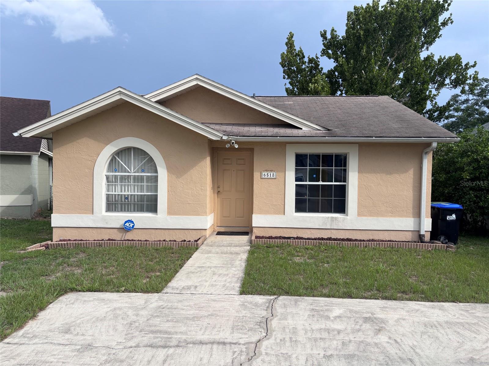 Welcome home to this beautifully updated, move-in-ready gem tucked away on a quiet cul-de-sac in Orlando! From the moment you step inside, you will be impressed by the bright and airy open-concept living space, freshly painted in a crisp, modern palette. The entire home features durable, waterproof luxury vinyl plank flooring—perfect for low-maintenance living. The heart of the home is the stunning, fully renovated kitchen, boasting brand-new shaker cabinets, gleaming quartz countertops, and plenty of workspace for cooking. Both bathrooms have been completely refreshed with new, stylish vanities and updated finishes. Located just minutes from major highways, dining, and shopping, this property perfectly combines modern convenience with peace of mind. Ideal for a first-time homebuyer or anyone looking for a turnkey property with no work left to do. Schedule your private showing today before this one is gone