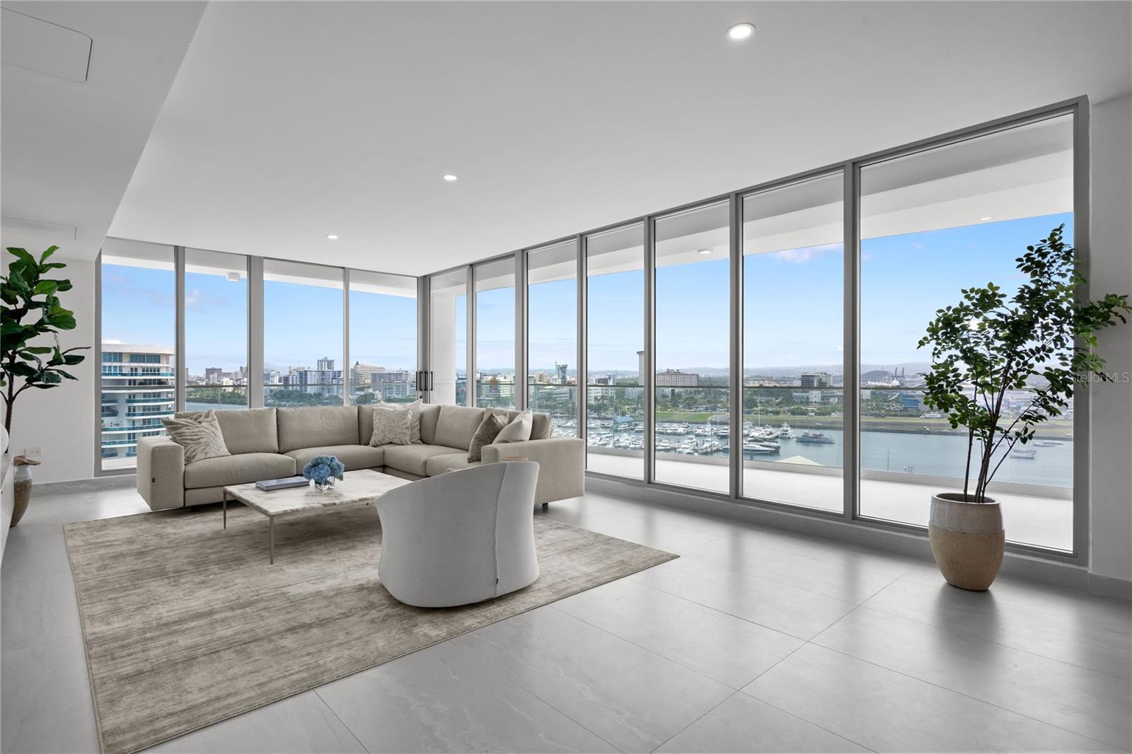 Introducing a singular opportunity to own a distinguished Penthouse residence in Le Parc, an exclusive new address in San Juan, Puerto Rico. Completed in 2025 and never before lived in, this exquisite home redefines contemporary island living—where refined design, comfort, and sophistication converge in one extraordinary setting. This turnkey, fully furnished penthouse is ready to be yours.
Poised above the San Juan Marina, this expansive 4,100-square-foot residence features four bedrooms and four and a half bathrooms, each thoughtfully designed to blend classic elegance with modern luxury and tastefully curated European furniture. The interior spans 3,250 square feet, showcasing 9-foot ceilings, custom-crafted cabinetry, and floor-to-ceiling windows that frame sweeping views of the Atlantic Ocean and city skyline. 
The open concept living and dining areas strike a seamless balance between grandeur and intimacy, creating an ideal environment for both quiet evenings and elegant entertaining. The gourmet kitchen is a chef’s dream, appointed with top-tier appliances, richly detailed cabinetry, and a generously sized quartz island, all anchored by timeless materials and exceptional craftsmanship. 
Each of the four-bedrooms have been designed as a private retreat, featuring en-suite bathrooms, custom closets, and serene finishes. The primary suite is a haven of comfort, complete with a spa-inspired bathroom offering dual vanities, sleek chrome fittings, and a glass-enclosed rain shower with tranquil views over the marina. A wraparound terrace spanning 850 square feet invites effortless outdoor living—from sunrise coffee to sunset gatherings. Integrated smart home system optionality, full shades, and temperature-controlled wine storage enhance everyday living with intuitive convenience. 
Le Parc is an intimate, 34-residence community, ensuring the utmost privacy and unrivaled amenities. Residents enjoy access to an opulent 4,000-square-foot rooftop oasis featuring wine lockers, bar, and multiple lounging terraces poised for sunset views and ocean vistas. The amenity offering continues with dual swimming pools, outdoor BBQ and kitchen, lounge areas, pickle ball court, dog run, and children’s play area. A state-of-the-art fitness center includes steam and sauna rooms, a cold plunge spa, and massage room.  24/7 security, 4 dedicated parking spaces with EV charging connection and climate-controlled storage provide everyday ease and peace of mind. This is more than a residence—it is a lifestyle of unparalleled refinement. In the heart of Puerto Rico’s most coveted coastal enclave, moments from the Isla Grande Airport, Condado, Old San Juan, and Escambron Beach, this one-of-a-kind Penthouse at Le Parc awaits its discerning new owner.