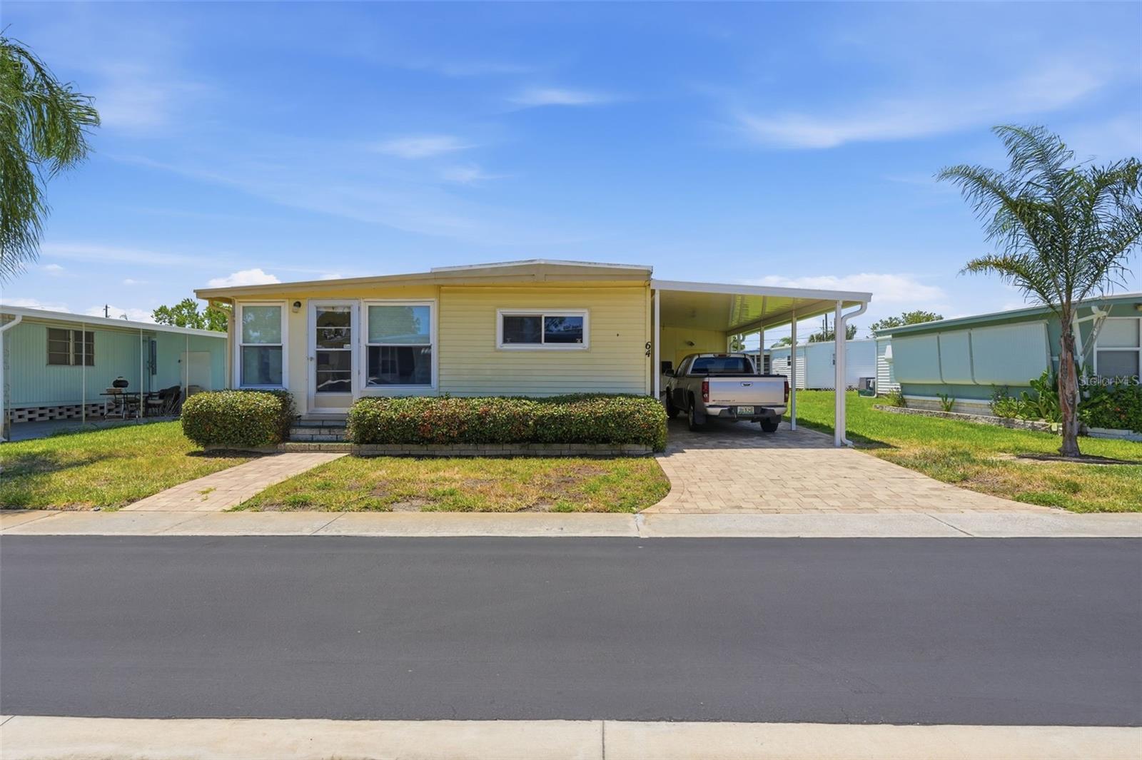 Virtually Staged. One or more photos have been virtually staged.
Welcome to this charming 2-bedroom, 2-bath manufactured home located in a friendly and active 55+ community. Built in 1971 and lovingly maintained by the same family for generations, this home offers a wonderful opportunity to enjoy comfortable Florida living while adding your own personal touches over time.
The home features a spacious living area, dedicated dining space, and a functional kitchen with ample cabinet storage. The primary bedroom includes a private bathroom, while a second bedroom and full bath provide flexibility for guests, hobbies, or a home office. Recent improvements include newer toilets, and the home offers plenty of potential for customization to suit your style and needs.
Residents enjoy access to a community pool and a monthly neighborhood newsletter that helps keep neighbors connected through local activities and events. Conveniently located near shopping, dining, medical facilities, golf courses, and many of Florida's popular attractions, you'll have easy access to everything needed for everyday living and recreation.
Whether you're searching for a full-time residence, a seasonal getaway, or the perfect snowbird retreat, this well-cared-for home offers affordability, character, and the opportunity to become part of a welcoming community. Schedule your private showing today and discover all the possibilities .