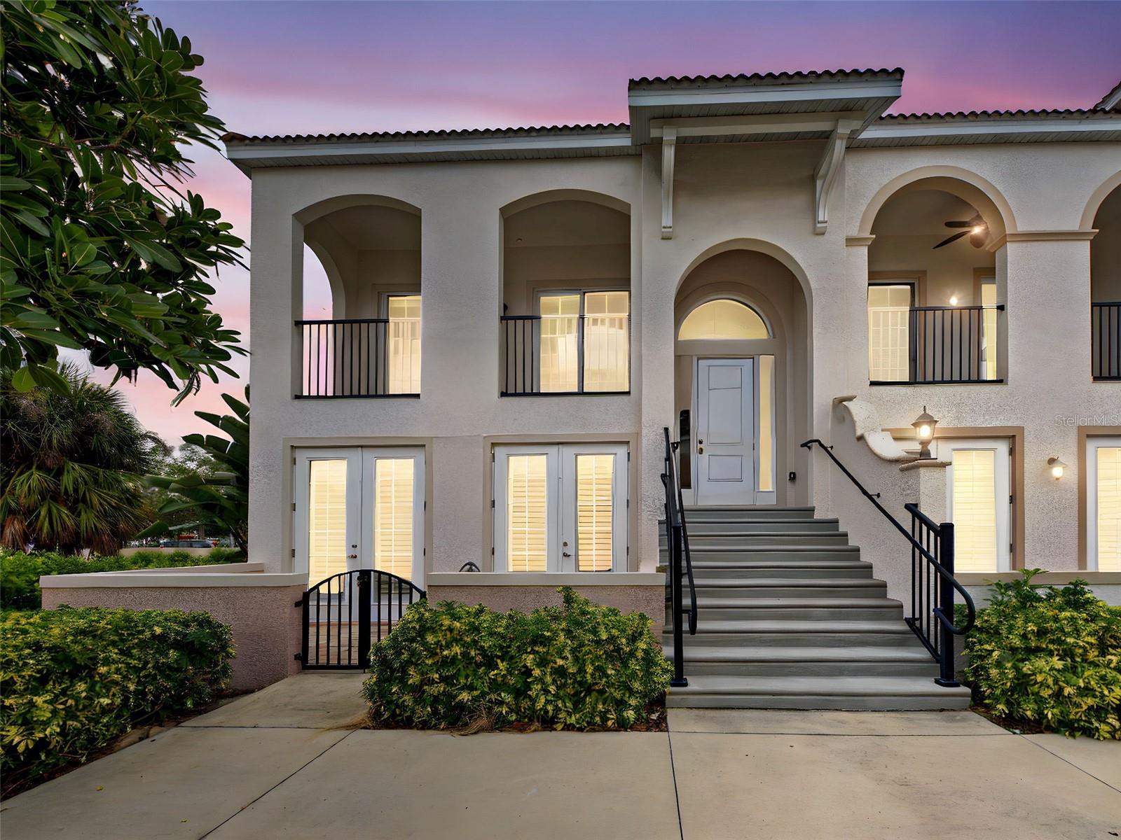 Virtually Staged. A Must See! On the Island of Venice, a beautiful END UNIT with multiple outdoor spaces, 2 car garage and even your own elevator. This end unit has additional windows allowing natural light to enter and fill the space. The tall ceilings and 8' raised panel interior doors add to the appeal of this home. This unit is conveniently located near shopping, dining, parks, beaches and all that Venice has to enjoy. All appliances and AC have been recently replaced so no issues there. There is additional storage located below the staircase. Schedule your showing today!