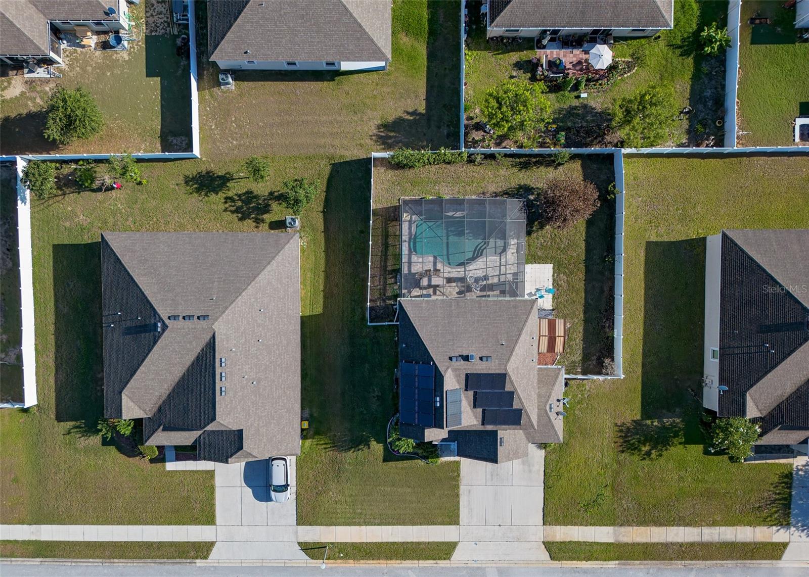 Welcome to 15542 Gemini Drive. This is the kind of home that makes everyday life feel like a vacation. Imagine coming home, opening the sliding glass doors, and hearing the peaceful sound of your own private waterfall as the sun reflects off the pool. 
With 3 bedrooms, 2.5 bathrooms, over 2,242 square feet, a 3-car garage, and fully paid-off solar panels for energy savings, this home offers the space, comfort, and the Florida lifestyle so many buyers are searching for. The larger fully fenced lot gives you rare breathing room between neighbors while still creating a cozy, private feel. Inside, the heart of the home is the oversized kitchen featuring granite countertops, tons of cabinet storage, and an open layout that flows directly into the family room, perfect for entertaining, holiday gatherings, or simply staying connected while cooking dinner. There is also a separate living room and dining area downstairs, giving everyone space to spread out.
But the real showstopper is the backyard oasis. Step outside to your screened-in saltwater pool complete with a waterfall feature, sun shelf, paver patio deck, and automatic retractable awning for shade on warm summer afternoons. The poolside outdoor Tiki Bar with built-in grill and mini refrigerator was made for weekend cookouts, pool parties, and relaxing evenings under the Florida sky.
Upstairs, the spacious primary suite feels like a retreat of its own with a huge walk-in closet and private en-suite bathroom. Two additional bedrooms, full bathroom, laundry room, plus a versatile loft provide flexible space for guests, a home office, playroom, or media area. Located in one of Lake County's fastest-growing communities, this home offers the charm of a quieter setting with convenient access to the expanding shopping, dining, recreation, and employment opportunities throughout South Lake County and Central Florida.
If you’ve been searching for a Florida pool home with indoor-outdoor living, energy-efficient features, room to entertain, and the kind of backyard you’ll never want to leave, this one checks all the boxes.