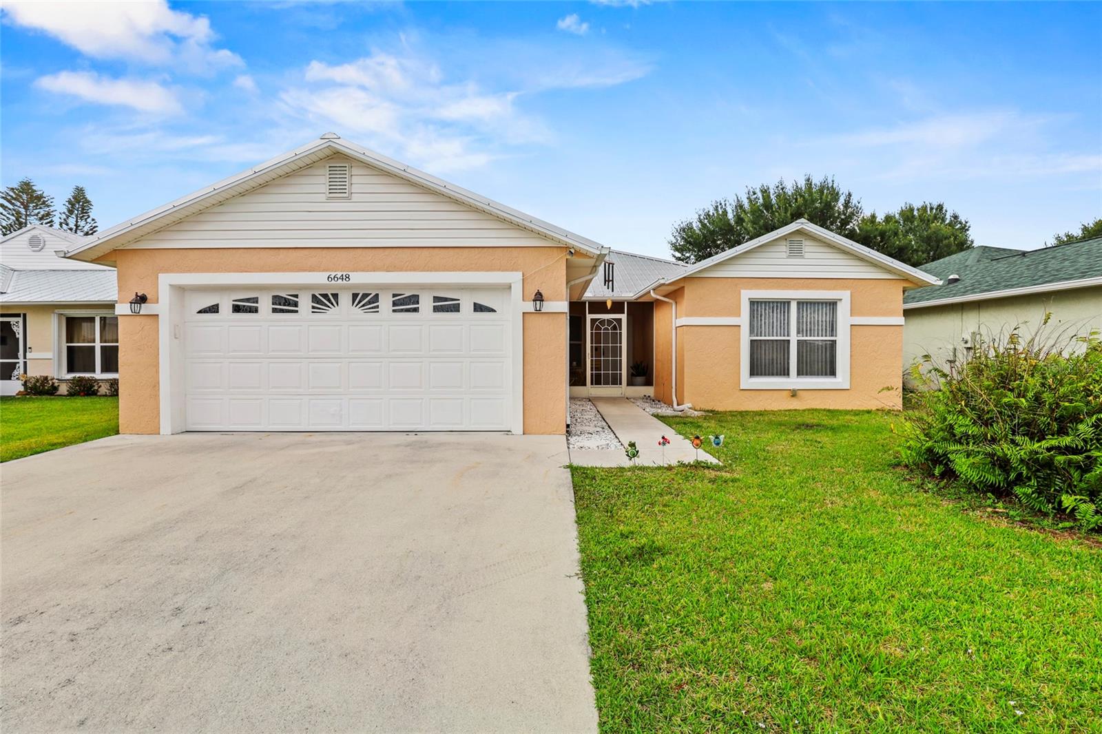 Welcome to this beautifully updated 3-bedroom, 2-bath home located in the up-and-coming area of Fort Pierce within a desirable 55+ community. This move-in ready property features a newer roof (2021), newer A/C (2020), and newer water heater for added peace of mind. Inside, you’ll find stylish porcelain tile flooring throughout, fully renovated tiled bathrooms and showers, quartz countertops, and newer stainless steel appliances in the kitchen. The bright and functional layout offers modern comfort with tasteful upgrades throughout. Enjoy the Florida lifestyle from the large screened-in patio and covered porch—perfect for relaxing or entertaining. Conveniently located near shopping, dining, and major roadways, this home is ideal for year-round living or a seasonal getaway in one of Fort Pierce’s growing areas.