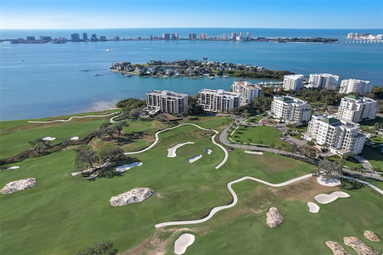 Nestled within a gated waterfront community and surrounded by one of the nation’s premier golf destinations, this beautifully positioned first floor condominium offers an exceptional Belleair lifestyle. Located alongside the renowned Belleair Country Club, ranked among the Top 100 golf courses in the United States, this spacious 2 bedroom, 2 bathroom residence combines comfort, elegance, and resort-style living.

Situated in one of the community’s premier buildings, the condo features under building parking, a large private storage room, and a fabulous extended lanai perfect for enjoying Florida’s indoor-outdoor lifestyle. Residents enjoy a stunning waterfront pool area with a true resort-style atmosphere, along with the peace of mind of a 24-hour guard-gated entrance, creating the ideal setting to relax and unwind.

For golf enthusiasts, this property presents a rare opportunity. Ownership provides the ability to apply for membership to the prestigious Belleair Country Club and bypass the club’s current five-year waitlist, an incredible advantage for those seeking immediate access to one of Florida’s most iconic private clubs.

Ideally located just minutes from world-famous Gulf beaches, fine dining, shopping, grocery stores, and only approximately 30 minutes from Tampa International Airport, this maintenance-free residence offers the perfect combination of luxury, convenience, security, and timeless Belleair charm.