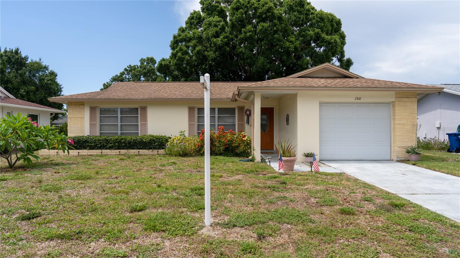 Come enjoy life in the very Active 55+ Golf Community of Highland Lakes in this Outstanding updated 2 bedrooms, 1 and 1/2 baths, garage home.  The home is complete with Wood laminate & ceramic tile floors.  Living Room/ Formal Dining Room combo, Light and Bright eat in kitchen overlooking the screened in patio that is ready for barbecuing or just relaxing.  Inside Laundry, Breakfast room & Leisure room.  Spacious & Relaxing with the screened Lanai and Shaded backyard.  This home has many upgrades and sits on a beautiful lot with Mature trees.  2 Spacious bedrooms with great storage.  For only $164/month you get all the wonderful amenities that Highland Lakes offers including golf membership for 2, with no green fees, 2 Community pools, lots of clubs and activities, tennis, shuffleboard, boat access to Lake Tarpon and so much more!  Highland Lakes is conveniently located in beautiful Palm Harbor, close to Tampa International Airport, plenty of shopping, award winning beaches, restaurants and so much more.