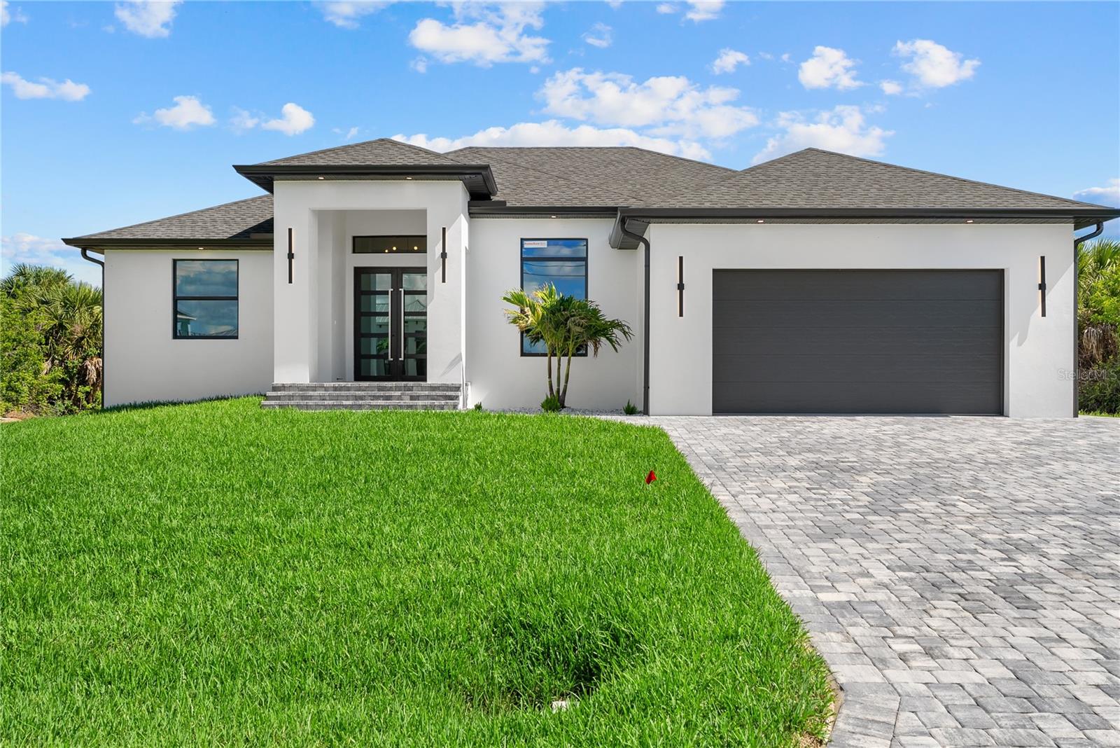 Welcome to your dream home in the highly sought-after South Gulf Cove community! This stunning new construction residence offers 3 bedrooms, 2 full bathrooms and a dedicated office. Designed with energy efficiency in mind, the home includes foam insulation in both the attic and garage, helping improve comfort and reduce energy costs year-round.Built for both luxury and functionality, this home features an open-concept floor plan, high ceilings, designer finishes, and abundant natural light throughout. The spacious gourmet kitchen flows seamlessly into the living and dining areas, creating the perfect setting for entertaining and everyday living. Home is foam insulated through out 
Step outside to your private outdoor oasis complete with a resort-style heated pool and jacuzzi, outdoor bbq kitchen, and convenient pool bath access — ideal for enjoying the Florida lifestyle year-round. 
Located in the desirable waterfront and boating community of South Gulf Cove, residents enjoy close proximity to beaches, golf courses, marinas, shopping, dining, and outdoor recreation. Whether you’re searching for a full-time residence, vacation retreat, or investment property, this exceptional home offers the perfect combination of comfort, style, and coastal living.