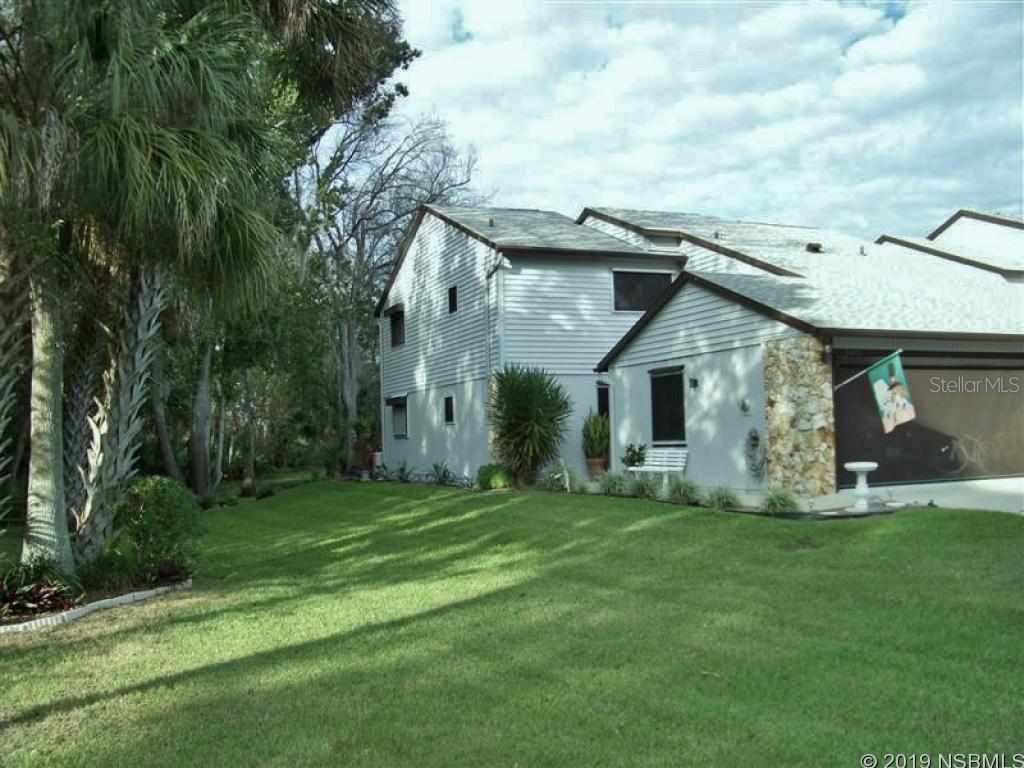 Wonderfully private setting that is hard to find in a townhome or condo community. You'll hardly know you have neighbors. Spacious side yard bordering on park-like setting. Your backyard is a beautiful waterfront view of well-maintained wooded common grounds. You won't find a more private or nicer setting at the end of quiet cul de sac. Well-maintained townhome features ground floor master suite and 1/2 bath for your guests, vaulted ceilings, sunny FL room overlooking tranquil pond and fountain, plus a nice wood deck nestled in your little private corner of the world, ready for entertaining and your BBQ. Third bedroom is large open loft , would make the perfect home office or flex room, with large walk-in closet. Corner unit features roll-down shutters, manual and powered, shutter panels  and 3M hurricane film protection on some windows. 2-car garage has roll down screen. New A/C system 2016 with 12 year assignable warranty. Best compromise between a home and a condo ... you own your lot, and can garden and improve your landscaping and outdoor space. The H.O.A. takes care of the exterior of the building and the lawn and sprinkler, for a care-free lifestyle - the best of both worlds. HOA replaced roof and gutters in 2018. Low H.O.A. monthly dues also provide you with termite bond, insurance coverage on building exterior, as well as large swimming pool, heated spa, large clubhouse with full kitchen, and lighted tennis courts and shuffleboard. Close to shopping, dining, short drive to beach, a great location at a great price. Owner occupied and cared for, easy to see by appointment. ;Water: City