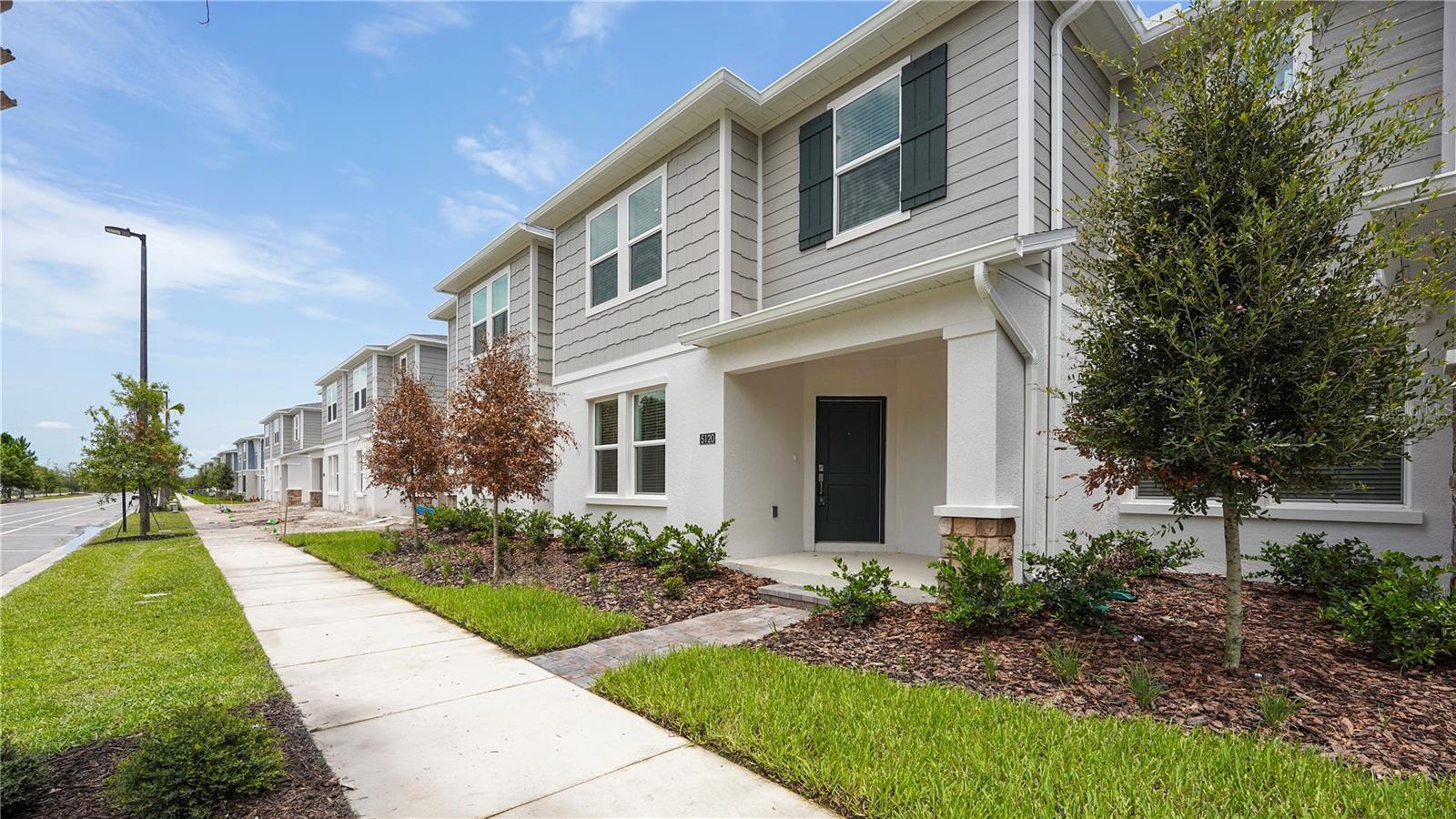 Move-in ready 3-bedroom, 2.5-bath townhome with a spacious loft and 2-car garage located in the highly sought-after Glades at CrossPrairie community. This beautifully designed home features an open-concept floor plan with luxury vinyl flooring throughout the main living areas, a modern kitchen with quartz countertops, stainless steel appliances, oversized island, and plenty of cabinet space. The first floor offers a bright and airy living and dining area perfect for entertaining, while upstairs you'll find all bedrooms plus a versatile loft ideal for a home office, playroom, or additional living space. The spacious primary suite features a walk-in closet and private bath with dual sinks and a large walk-in shower. Internet is included in the rent for added convenience. Residents enjoy resort-style amenities including a community pool, fitness center, playground, walking trails, and dog park. Conveniently located just minutes from the Florida Turnpike, shopping, dining, Lake Nona Medical City, Orlando International Airport, Downtown St. Cloud, and Lakefront Park. Experience comfort, convenience, and modern living in one of St. Cloud's newest and most desirable communities.