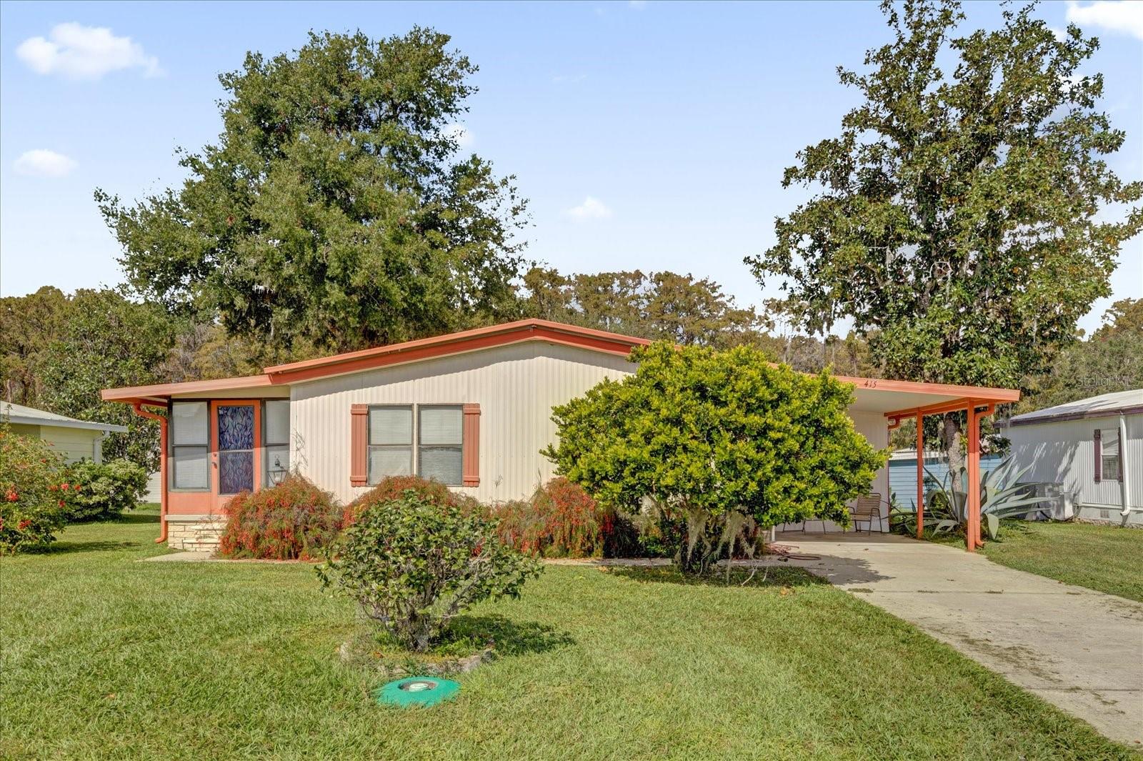 By far the best value in Continental Country Club, located minutes from the Villages! This clean, functional, move-in ready home offers a fantastic opportunity to enjoy everything the retired lifestyle is known for—golf, recreation, entertainment, and an active 55+ community. While the home could benefit from some cosmetic updates, the price simply can’t be beat, making it the perfect opportunity to add your own personal touches and build instant value. The seller is also offering a $1,000 closing cost credit for buyers who close within 30 days of contract.

Inside, you’ll find a spacious and inviting layout with a bright living room that flows into an air-conditioned Florida Room, creating additional space for relaxing or entertaining year-round. The main living areas feature luxury vinyl plank flooring, offering a clean, modern, and low-maintenance feel. The kitchen includes a convenient breakfast bar, while the dining area features a built-in hutch for extra storage and display. The primary suite offers a large walk-in closet and an en-suite bath with a walk-in shower. An attached workshop and carport add extra convenience and functionality.

Living in Continental Country Club means enjoying a true resort-style lifestyle with access to an impressive list of amenities including an 18-hole championship golf course, clubhouse with restaurant and lounge, pool, tennis and pickleball courts, fitness center, library, billiards room, arts and crafts studios, a woodcrafter’s shop, and shuffleboard courts. Residents also enjoy access to Lake Okahumpka for boating, fishing from the dock, and on-site boat storage. The community is conveniently located just five minutes from The Villages with easy access to shopping, dining, entertainment, and medical services, and near I-75 and the Florida Turnpike, placing Orlando about an hour away and Tampa or Daytona Beach roughly 90 minutes away. Buyers must be 55+ with a minimum 700 credit score and complete a community application and credit check. This is an incredible opportunity to enjoy the Florida lifestyle in a well-maintained home with endless potential.