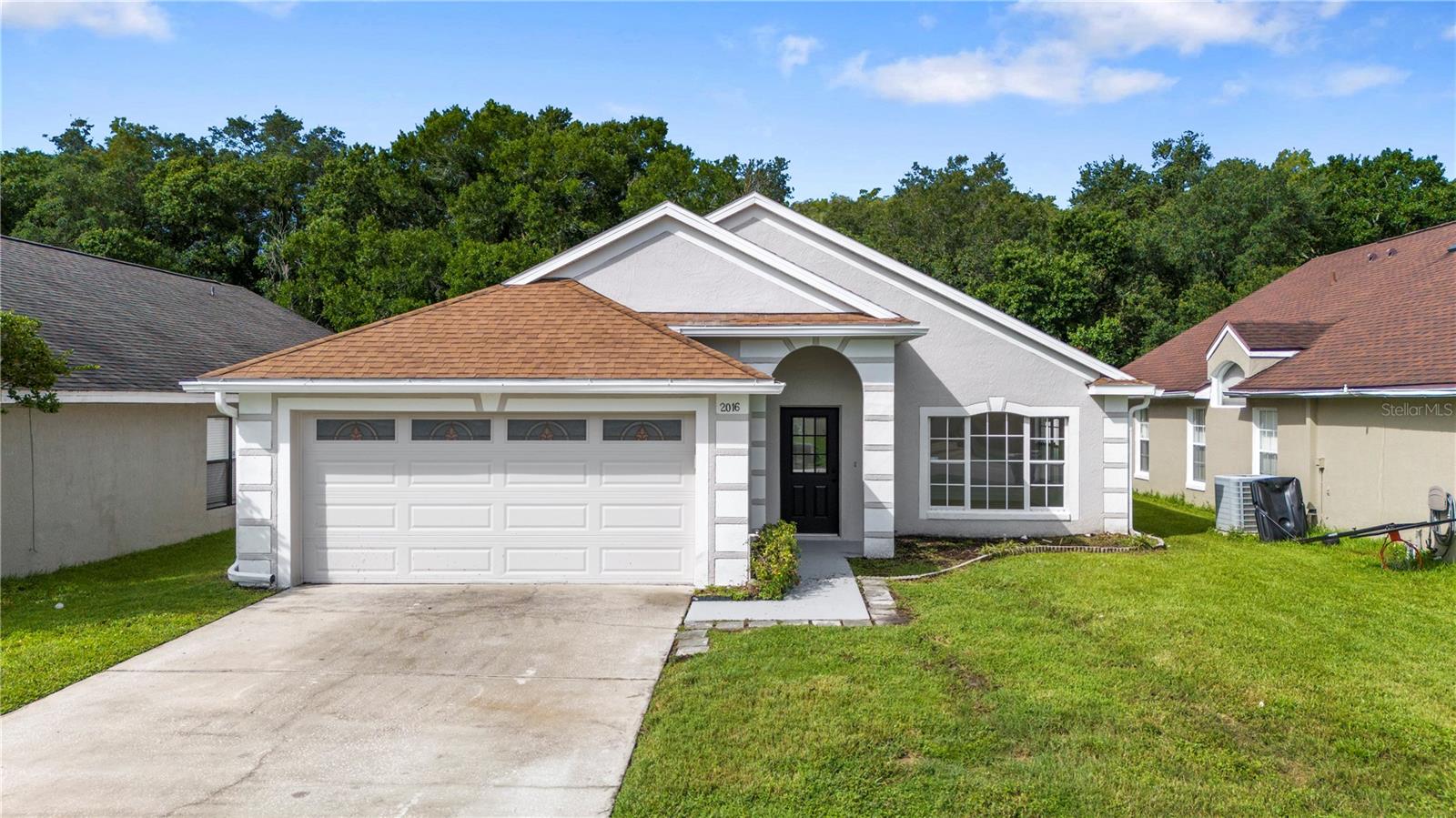 Welcome to 2016 Locust Berry Dr, a beautifully updated 3-bedroom, 2-bath home in Kissimmee offering modern finishes, comfortable living spaces, and a peaceful rear conservation backdrop. This move-in-ready home features brand new luxury vinyl plank flooring, fresh interior and exterior paint, new doors, and a new A/C system for added comfort and efficiency.

The remodeled kitchen showcases contemporary finishes including wood soft-close cabinetry, quartz countertops, and new stainless steel appliances. Both bathrooms have been tastefully upgraded with modern wall tile, new vanities with quartz countertops, new toilets, fixtures, and a clean contemporary design. The primary suite includes a walk-in closet, while the open living areas provide a bright and functional layout.

Step outside to enjoy the newly screened rear enclosure overlooking conservation, creating a private and relaxing outdoor setting with no rear neighbors. The home also features a 2018 roof, giving buyers added confidence in the major systems.

Conveniently located near shopping, dining, major roadways, and Central Florida attractions, this home offers easy access to The Loop shopping and entertainment district, nearby restaurants, grocery options, Osceola Parkway, Florida’s Turnpike, Lake Nona, Orlando International Airport, and the Kissimmee SunRail/Amtrak station for commuter convenience.