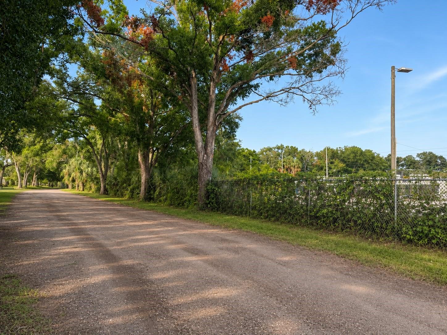 Welcome to this spacious two-story single-family home situated on approximately 1.40 acres in Tampa’s Palm River area. Offering 3 bedrooms, 2 bathrooms, and approximately 2,188 square feet of living space, this property provides plenty of room for comfortable living and endless possibilities. The expansive lot features multiple utility structures, open storage areas, a wood deck, and a concrete patio—ideal for outdoor activities, additional storage, hobbies, or future improvements. The home offers central air conditioning, a functional layout, and a combination of concrete block construction, stucco, and siding. With generous indoor and outdoor space, this unique property is ready for its next owner to personalize and make it their own. Schedule your private showing today!