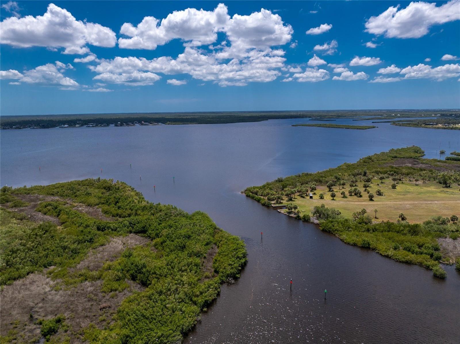 The moment your eyes behold this lakefront oasis you will be compelled to make it your own. Where dreams are made of located in an upscale Boutique community of 18 lots Riverbend Estates. Discover the perfect opportunity to build your dream home on a 1/2 acre of land - or a multigenerational home on a full acre should you decide to buy lot 1 as well. This land will become your sanctuary that beautifully embraces an outdoor setting that only few ever have the pleasure of owning. Riverbend Estates offers an exclusive boat ramp to launch your boat giving you quick access to the Myakka River, Charlotte Harbor & the Gulf by way of the Jupiter/Apollo waterway or just fish off the dock & set a spell in the warm summer breeze.
Within easy access to I-75, golfing, beaches, restaurant's, shopping, hospital, Tampa Ray, Braves, cultural activities, historic Punta Gorda, airports & all other amenities to be found in this hidden gem