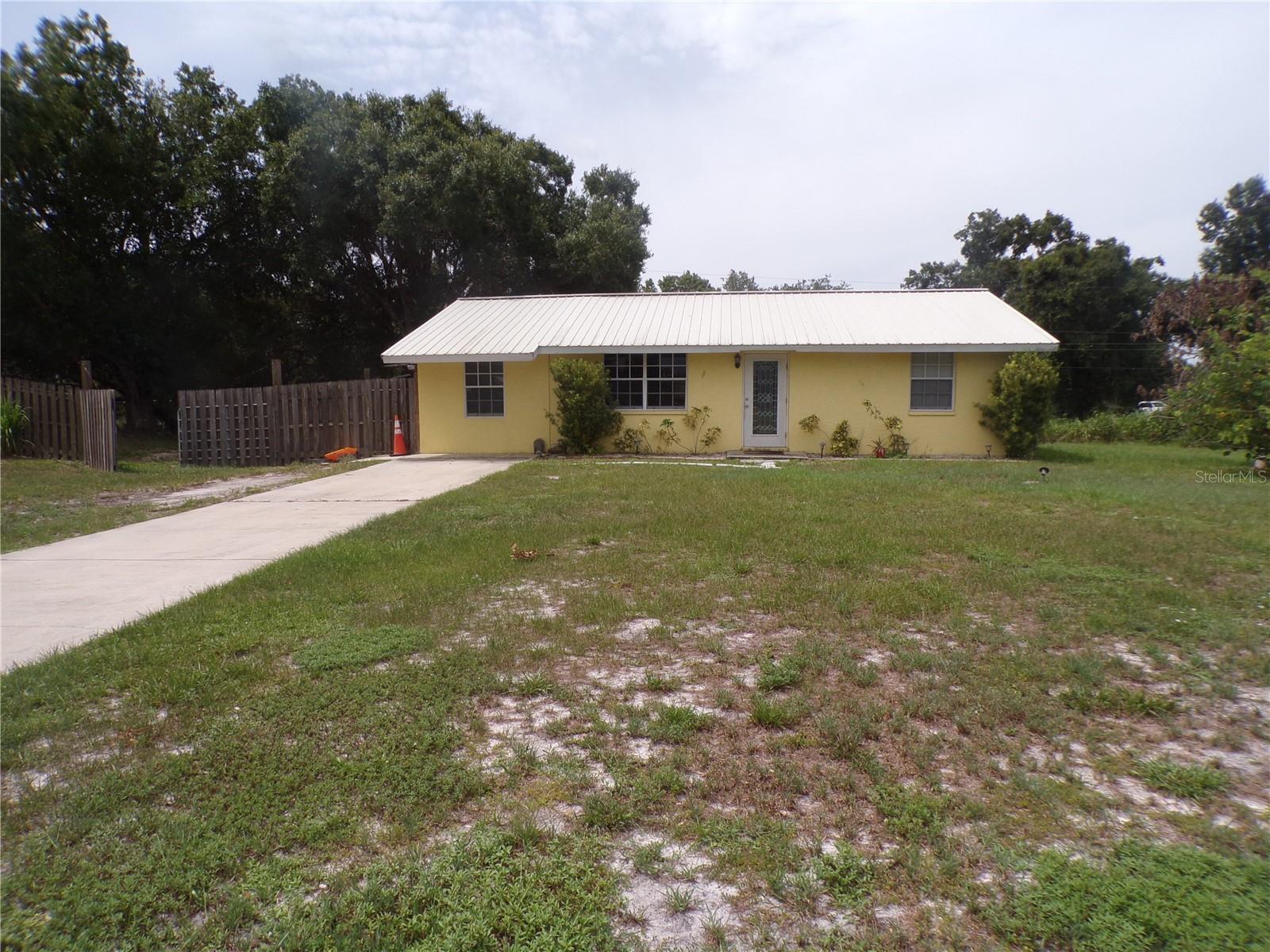 ANNUAL - UNFURNISHED - 2 bedroom - 2-and-a-half-bathroom home on 2.5 LOTS in Ridge Harbor community, with NO DEED RESTRICTIONS!!  Luxury Vinyl Plank flooring, newer light fixtures and a spacious layout. The living room is open to the kitchen and inside laundry room, both with great natural light. The primary bedroom features en-suite half bathroom. The guest bedroom is next to a full bathroom with tub/shower combo. On the opposite side of the home beyond the stylish new barn door, find bonus space that could be used as a den or third bedroom, AND a separate office space with extra storage. Enjoy shade trees, concrete slab for grilling or a picnic table and a shed. This home is located in a community that has an optional HOA to be a part of the community center activities and provides access to the private community boat ramp for access to Shell Creek. Park your boat, RV, or other toys at your home and use whenever you like! It is also very close to downtown Punta Gorda, I-75, PGD airport, and great shops, restaurants, parks, and more!