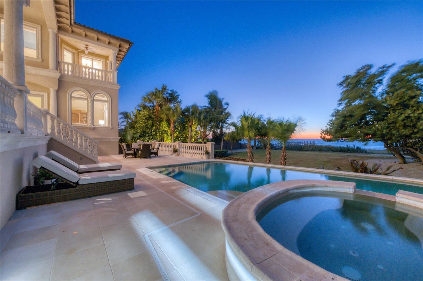 Experience unparalleled luxury on the coveted south end of Casey Key, where this custom Gulf-front estate offers 90 feet of pristine beach frontage, endless views of the turquoise Gulf waters, and the most walkable wide beach on the Key. Built with timeless craftsmanship, the residence spans over 12,000 square feet in total, featuring five bedrooms, six-and-a-half baths, and two spectacular primary suites with sunset balconies, spa-inspired baths, and expansive custom closets. Designed for both elegance and comfort, interiors include a soaring two-story living room, gourmet chef’s kitchen with Wolf, Sub-Zero and Cove appliances, formal dining with Venetian plaster, home theater, gym, and private office with water views. The technology package including automated lighting, programmable blinds, and secure hardwired internet. Outdoors, a Gulf-front saltwater pool and spa, summer kitchen, and private dune walkover create the ultimate coastal retreat. Additional luxuries include a 1,000-gallon propane tank which runs the whole home generator, elevator, R/O water filtration system, and impact-rated windows and doors. Perfectly situated minutes from boating, marinas, fine dining, and the cultural attractions of Sarasota and Venice, this exceptional Casey Key estate is move-in ready and awaits as your exclusive beachfront sanctuary.