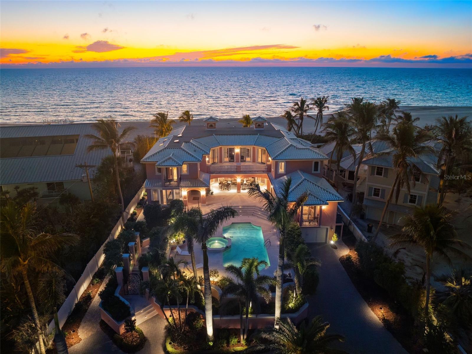 Discover the pinnacle of private Gulf-front living along Captiva Island’s exclusive Gold Coast. This magnificent gated estate is a rare and extraordinary beachfront sanctuary, offering a seamless blend of seclusion, sophistication, and breathtaking natural beauty. Set on a one-of-a-kind parcel with direct access to Captiva’s pristine sugar-sand beaches, this remarkable family compound delivers an unrivaled connection to the turquoise waters of the Gulf of Mexico and awe-inspiring sunsets. The grand main residence boasts six bedrooms and six-and-a-half baths, each crafted with exquisite architectural details and unparalleled craftsmanship. A two-story great room with soaring coffered ceilings, a gas fireplace, and panoramic Gulf views creates a dramatic yet inviting atmosphere. The formal dining room is elegantly appointed, while the gourmet kitchen is a chef’s dream, fully equipped with top-tier appliances and custom finishes. A one-of-a-kind, hand-painted private elevator adds an artistic touch to this coastal masterpiece. Designed for both privacy and indulgence, each bedroom suite features private balconies and screened lanais, providing serene Gulf breezes and unobstructed sunset views. The primary retreat is a sanctuary unto itself, offering his-and-her spa-inspired baths, a soaking tub, dual showers, double vanities, a morning bar, and expansive walk-in closets. Step onto your private screened lanai and take in the breathtaking ocean vistas as the waves roll onto the shore. An expansive coquina stone veranda surrounds the heated saltwater pool and spa, creating the perfect setting for luxurious outdoor living and entertaining. Six conveniently placed laundry rooms add to the home’s seamless functionality. The oversized two-car garage offers massive storage beneath the home for added convenience. A charming guest cottage enhances the estate, featuring two en-suite bedrooms, a full kitchen with breakfast bar, a spacious living area, and a private covered terrace. Additional amenities include two garages at the guest house, a large workshop, and ample storage space for all your island essentials. This exclusive beachfront oasis embodies the epitome of island luxury. Whether you seek a private sanctuary or an entertainer’s dream retreat, this Captiva estate is truly a rare gem that exceeds expectations....your paradise awaits. CAN BE PURCHASED WITH 16475 CAPTIVA DRIVE FOR RARE GULF TO BAY OPPORTUNITY!