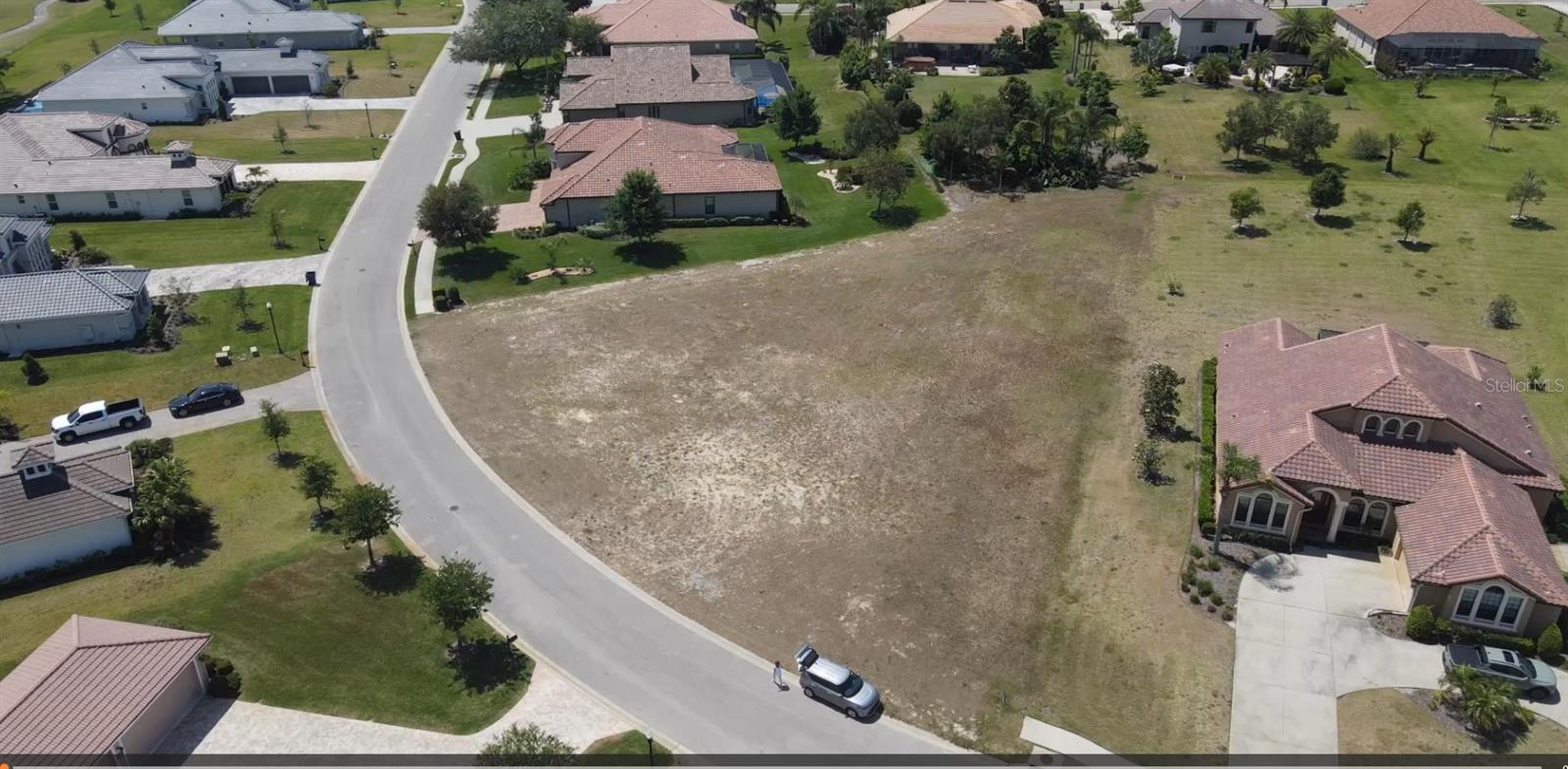 Build your dream home in the prestigious, guard-gated community of Lake Jovita. This .63-acre homesite is located on Carryback Drive, an exclusive and peaceful loop with minimal traffic—perfectly positioned away from the main thoroughfares of the neighborhood. This is the last remaining lot on Carryback Drive, offering a rare opportunity to secure one of the community’s most desirable locations.
You may choose your own builder or work with the seller’s preferred builder. The lot is fully serviced with electric, sewer, and cable already in place. Community building requirements include a minimum 3,000 sq ft (heated) home with a tile roof, and there is no required timeframe to build. Setback guidelines are: Front 30' / Rear 30' / Sides 7.5'. HOA dues are a low $114 per month.
Lake Jovita offers an exceptional lifestyle with two Championship Golf Courses and a variety of optional membership levels, including Social, Tennis, Swimming, and Fitness. Residents also enjoy a beautiful community park featuring a large playground, two dog parks for large and small dogs, basketball court, pickleball courts, and a scenic walking/running trail with exercise stations.
Located in the rolling hills of Dade City, Lake Jovita provides a serene setting just 35 minutes from downtown Tampa. This 24-hour guard-manned community is known for its natural beauty, top-tier amenities, and welcoming atmosphere. Come discover why so many have chosen to call Lake Jovita home. Don’t miss this rare opportunity—call today.