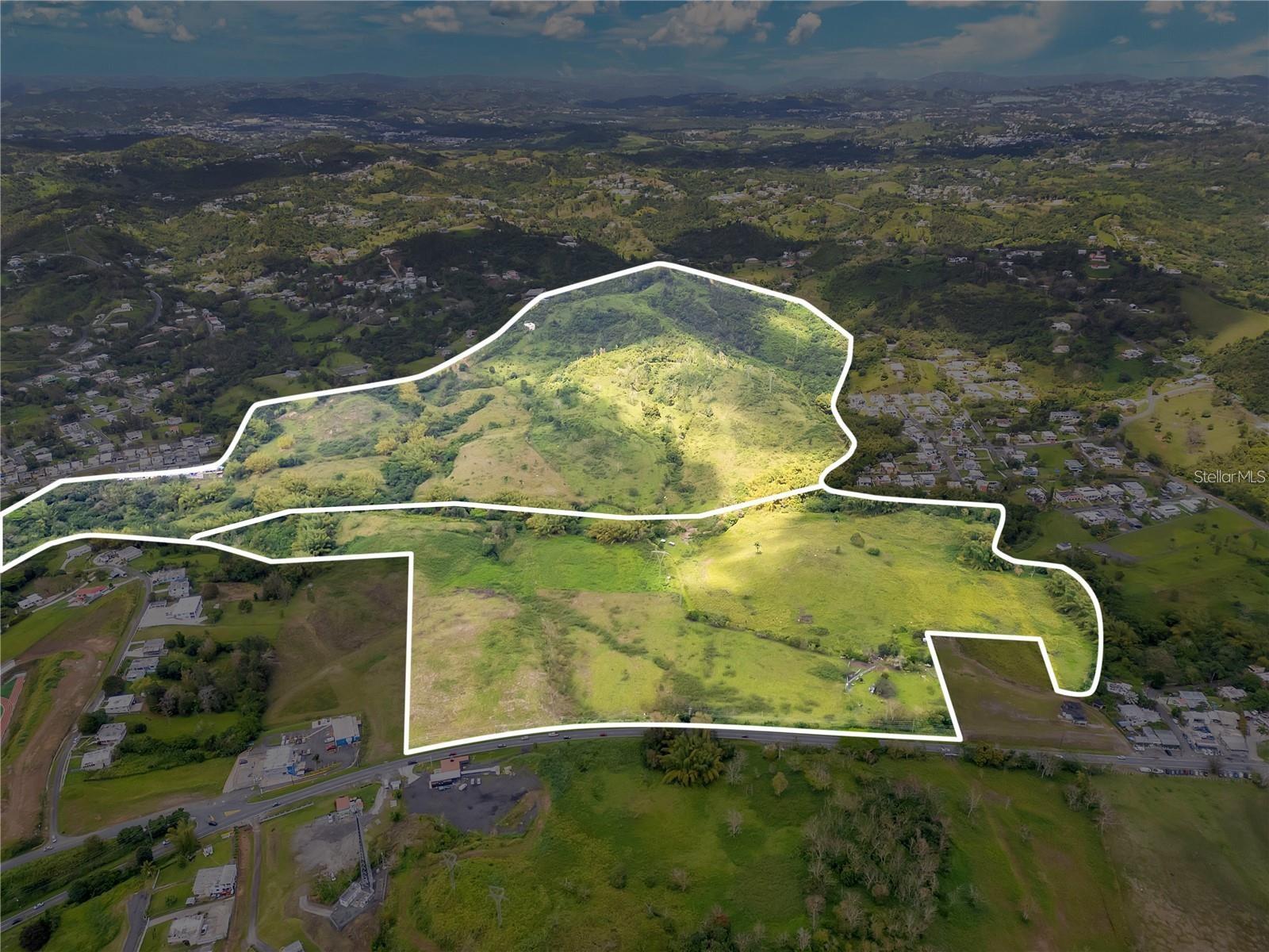 This massive estate is located at Road 7786 KM 0.5, Beatriz Ward, in the municipality of Cayey, PR (extending into Cidra). The property spans a total area of 151.22 cuerdas. It features a diverse and majestic mountainous topography, providing panoramic views and a vast natural canvas for large-scale development, ecological tourism, or a private conservation retreat. The site maintains excellent connectivity with frontage near major regional access points.

Zoned with a mixed classification of R-G (General Rural) at 47 percnt, C-R (Resource Conservation) at 29 percnt, and R-I (Intermediate Residential) at 24 percnt, the land offers versatile potential for sustainable housing or agricultural projects, supported by a rich soil profile including MxF, RoC2, and MxE. The property has a value of approximately $19,805 for each cuerda. Environmental records indicate the terrain is situated almost entirely within Flood Zone X (95.7 out of 100), with minor advisory portions in Zone A and X 0.2 ACF. This significant acreage represents a premier investment opportunity in the central mountain range.
Coordinates: 18.14318104, -66.12596315