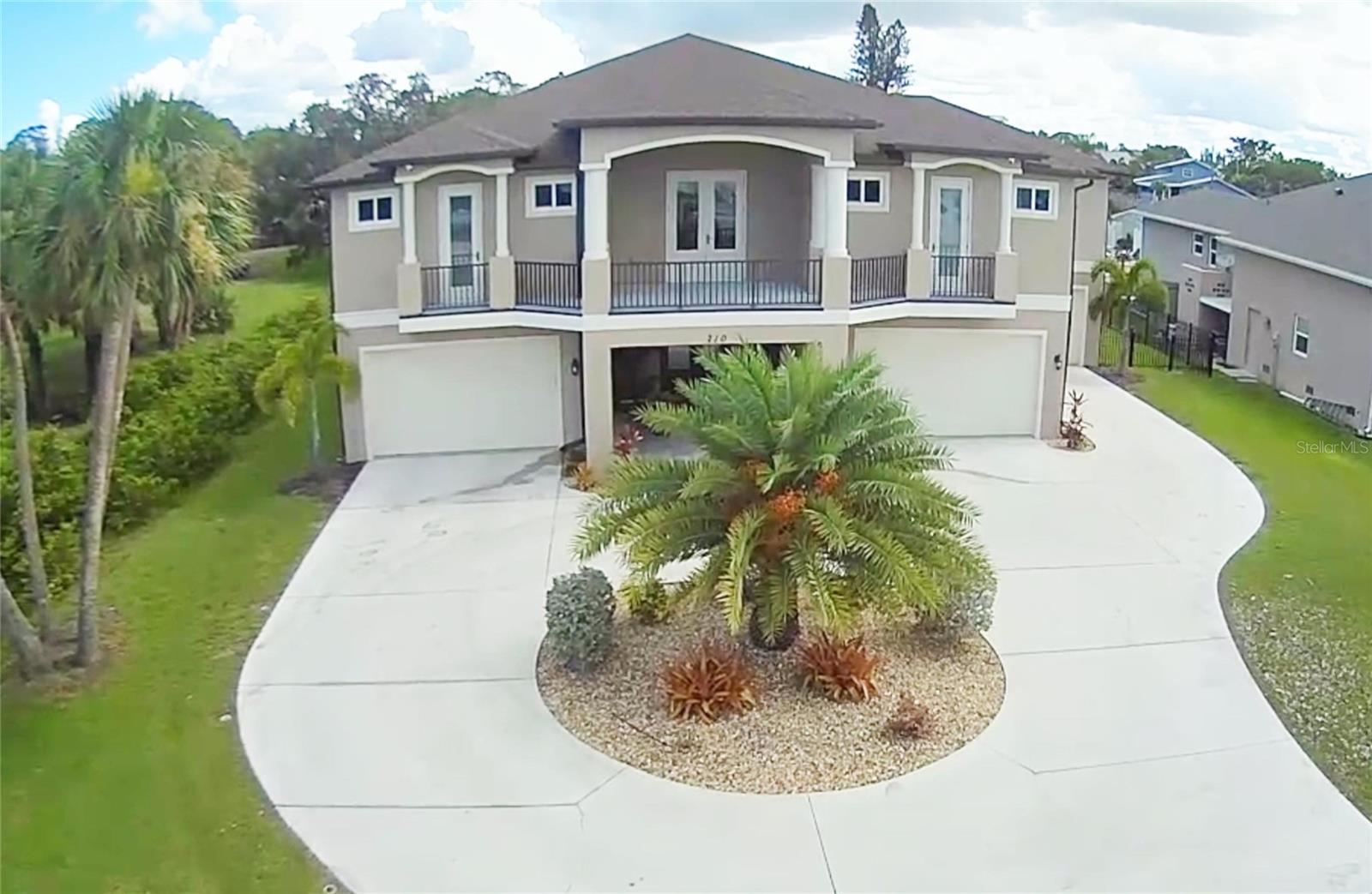 THIS 7,138 SQUARE FOOT ESTATE NESTLED ON NEARLY HALF AN ACRE OF CANAL FRONT WATER IN THE HEART OF NOKOMIS, FLORIDA FEATURES AN ELEVATED PRIMARY LIVING AREA DESIGN, IN ACCORDANCE WITH FLOOD ZONE REQUIRMENTS AND ENGINEERED BEYOND THE STANDARD 160 MPH WIND SPEED TO 180 MPH WIND SPEED, COMPLETE WITH FIBERGLASS IMPACT RATED DOORS - VINYL IMPACT ENERGY STAR WINDOWS - EXTERIOR BLOCK AND STUCCO CONSTRUCTION - STUCCO FINISHED EXTERIOR CEILINGS FOR EASY MAINTENANCE, WHOLE HOUSE STANDBY GENERATOR AND UNDERGROUND ELECTRIC SERVICE FROM FP&L JUST TO MENTION A FEW OF THE MANY UPGRADED FEATURES THIS HOME HAS.

THE 500 GALLON UNDERGROUND PROPANE TANK RUNS THE GRILL - FIRE PIT - GENERATOR AND KITCHEN RANGE. THE OWNER/BUILDER IS A NATIVE FLORIDIAN, VERY FAMILIAR WITH HURRICANES AND BUILT THIS HOME NOT ONLY TO SURVIVE A HURRICANE, BUT LIVE COMFORTABLY AFTERWARDS. THE IRRIGATION SYSTEM IS ON GENERATOR BACKUP AND CAN BE USED TO SUPPLY NON-POTABLE WATER TO THE HOME UNTIL PUBLIC UTILITIES ARE RESTORED.   

ONCE INSIDE THIS BEAUTIFUL HOME, THE WARM HICKORY HARDWOOD STAIRCASE WITH LED STEP LIGHTING GREETS YOU AS YOU MAKE YOUR WAY UP TO THE ELEVATED MAIN LIVING AREA OF THE HOME. THE MAIN LIVING AREA FEATURES HICKORY HARDWOOD FLOORING - COFFERED CEILINGS - OPEN FLOOR PLAN - 8 FOOT DOORS THROUGHOUT - CUSTOM WOOD TRIM AND CASINGS AND SO MUCH MORE.

THE KITCHEN FEATURES TRANSLUCENT GRANITE COUNTERTOPS - OVER AND UNDER CABINET LED LIGHTING - STONE BACKSPLASH - HIDDEN WALK IN PANTRY (VERY UNIQUE) - ENERGY STAR GRAPHITE FINGERPRINT RESISTANT APPLIANCES - GAS COOK TOP AND DEDICATED COFFEE MAKER WATER LINE WITH UNDER THE SINK R/O SYSTEM. 

THE FEATURES AND ATTENTION TO DETAIL ON THIS HOME ARE AMAZING BUT YOU CAN'T TRULY APPRECIATE IT WITHOUT SEEING IT IN PERSON. THE CANAL WITH CONCRETE SEAWALL PROVIDES DEEP WATER ACCESS TO LYONS BAY AND THE GULF OF AMERICA. PARTIAL VIEWS OF LYON BAY CAN BE SEEN FROM THE FRONT BALCONY. THE OWNER INSTALLED A DEDICATED ELECTRIC SUBPANEL AND GAS LINE FOR A FUTURE POOL SHOULD YOU DECIDE TO INSTALL ONE ALONG WITH CONDUIT AND WATER TO SEAWALL FOR A BOAT LIFT. 

IF LOCATION IS IMPORTANT TO YOU THEN CONSIDER THE 5 MINUTE WALK TO NOKOMIS BEACH AND 5 MINUTE DRIVE TO I-75. DOWNTOWN VENICE SHOPPING AND RESTAURANTS ARE JUST A 5 MINUTE DRIVE AWAY AS WELL. DON'T MISS OUT ON THIS AMAZING HOME BUILT WITH BOTH FORM AND FUNCTION IN MIND. SCHEDULE YOUR PRIVATE SHOWING TODAY ! !