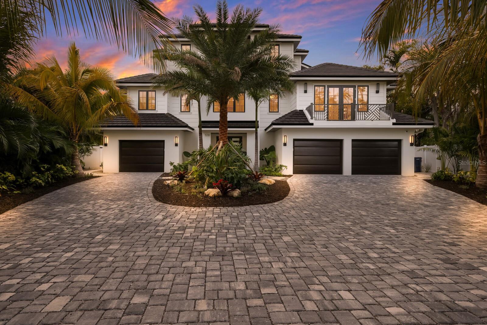 New Construction. Discover unparalleled sophistication in this remarkable 5,100 sq ft residence, elegantly positioned on a large, private 18,450 sq ft lot within a tranquil cul-de-sac and offering spectacular views of Bimini Bay. This furnished home exemplifies modern luxury living with its 5 bedrooms, 6 1/2 baths, including an attached one-bedroom apartment with a private entrance. The apartment itself is a highlight, featuring a full kitchen and offering ample space for guests or multi-generational living. The centerpiece of this stunning home is its state-of-the-art gourmet kitchen, featuring premium Sub-Zero, Wolf, and Bosch appliances, set amidst pristine quartz countertops. A spacious walk-in pantry with a built-in wine fridge, sink and countertop enhances the culinary space. The home features two master suites, with the primary master offering separate his/her bathrooms and expansive walk-in closets. Fitness enthusiasts will appreciate the dedicated, ground-floor gym/yoga studio, equipped with Peloton bike, rower, and treadmill. Outdoors, the property boasts a large, heated pool with a spa and fountains, an inviting outdoor kitchen, a fire pit area, and beautifully maintained, irrigated landscaping equipped with a MosquitoMist system. Additional luxuries include a new dock and 20K boat lift, perfect for boating enthusiasts, and a three-car garage. The home's interior is just as impressive, featuring extensive trim work throughout, a cozy fireplace in the main living room, and three distinct living areas for versatile living spaces. Advanced amenities like seven zoned AC, security cameras, integrated speakers, wifi, and smart thermostats provide both comfort and peace of mind. This exquisite property is more than just a home; it's a testament to luxurious living in a serene setting, with each element thoughtfully crafted for an extraordinary lifestyle. Embrace the beauty and elegance of this exceptional home, offering breathtaking views of Bimini Bay and a lifestyle of un compromised luxury.