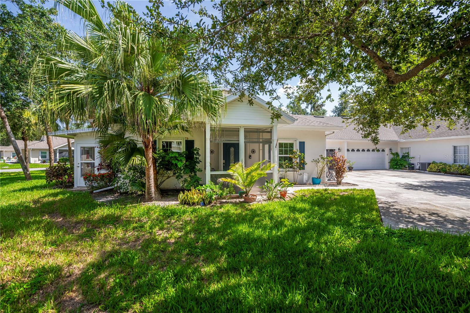 Welcome to your new home in the highly sought-after gated community of Heritage Oak Park! Surrounded by native oak trees and winding streets, this neighborhood offers a peaceful, country-like atmosphere while still being just minutes from shopping, dining, medical facilities, and beautiful Gulf beaches. This meticulously maintained & thoughtfully upgraded villa reflects true pride of ownership. It sits on a fantastic private lot backing up to a short, low traffic cul-de-sac street and in the center of the park-an exceptionally quiet location. This popular "A" Villa features an open, light-filled floorplan w/1364 sq. ft. under air, 9'4" volume ceilings, 2 bedrooms, a den/bonus room, 2 full baths, a spacious 2 car garage and an inviting year-round Florida room. Interior features & upgrades include enclosed tiled screened front porch w/new storm door and new Florida screen, new entrance door w/hurricane shutters, luxury vinyl floors thru-out entire villa except tile in both baths, ceiling fans thru-out (new in 2025 great room, kitchen, & both bedrooms) & window treatments thru-out inc. new verticals on the sliders, granite kitchen countertops w/under-mount sink, newer cabinet doors, upgraded LG black stainless appliance package, brand new disposal, & 3 drop down pendulum lights, spacious primary bedroom w/2 walk in closets and ensuite bath w/newer walk in shower & glass door. granite countertop w/dual undercounter sinks, & pendulum lighting, French doors leading to the den/bonus room, split bedroom layout, 2nd bath has tub/shower, granite counters & under counter sink, new plumbing fixture, & pendulum lighting, laundry room w/new top of the line LG full size washer & dryer, & garage with laundry tub, pull down staircase, & electric garage screens for ventilation. Additional features & updates inc. enclosed lanai w/tile floor for year-round enjoyment, new windows & hurricane shutters, new roof in 2017, fresh interior paint within last few years, new smoke detectors, new water heater in 2023. humidistat, whole house surge protector, &
additional R44 insulation in attic & more! Truly move in ready & beautifully maintained. Heritage Oak Park is a pet-friendly, active gated community where golf carts are welcome. An active on-site activity's director coordinates a full calendar of events. Amenities inc. a large clubhouse, heated pool, tennis courts, pickle ball, bocce ball, shuffleboard, horseshoes, lending library & billiard's room. All of this in a community not located in a flood zone.