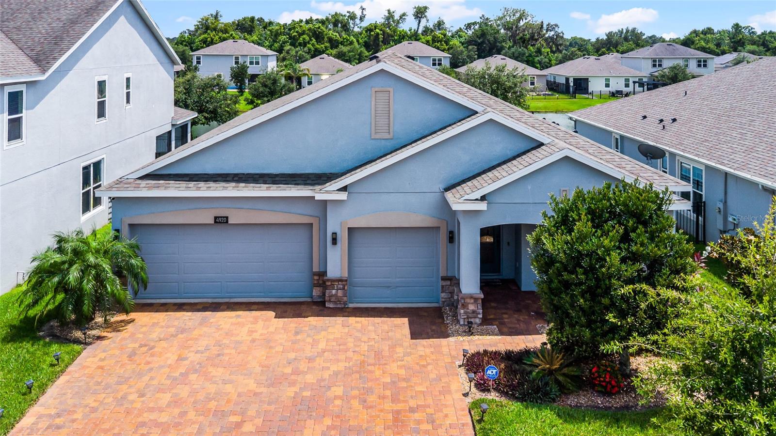 Beautifully upgraded 4-bedroom, 2.5-bath waterfront home in the gated community of Hanover Lakes. Offering 2,291 heated square feet, this residence features 12-foot ceilings, an open floor plan, and numerous upgrades throughout.

Situated on a navigable canal with potential for a private dock, the property provides access to Alligator Lake and the Alligator Chain of Lakes. The kitchen features upgraded GE stainless steel appliances, 42-inch cabinets, double ovens, and a large granite island. Triple sliding glass doors lead to a covered lanai and retractable screen porch, creating a comfortable indoor-outdoor living space.

Additional features include ceiling-mounted audio speakers, high-speed internet wiring, ADT security system, whole-house water filtration system, and a spacious three-car garage. The primary suite offers canal views and a custom walk-in shower.

Conveniently located near Lake Nona, Orlando International Airport, shopping, dining, major roadways, theme parks, and Florida beaches. Community amenities include a boat ramp, swimming pool, splash pad, pavilion, playground, and walking trails.

Contact your agent to schedule a showing.