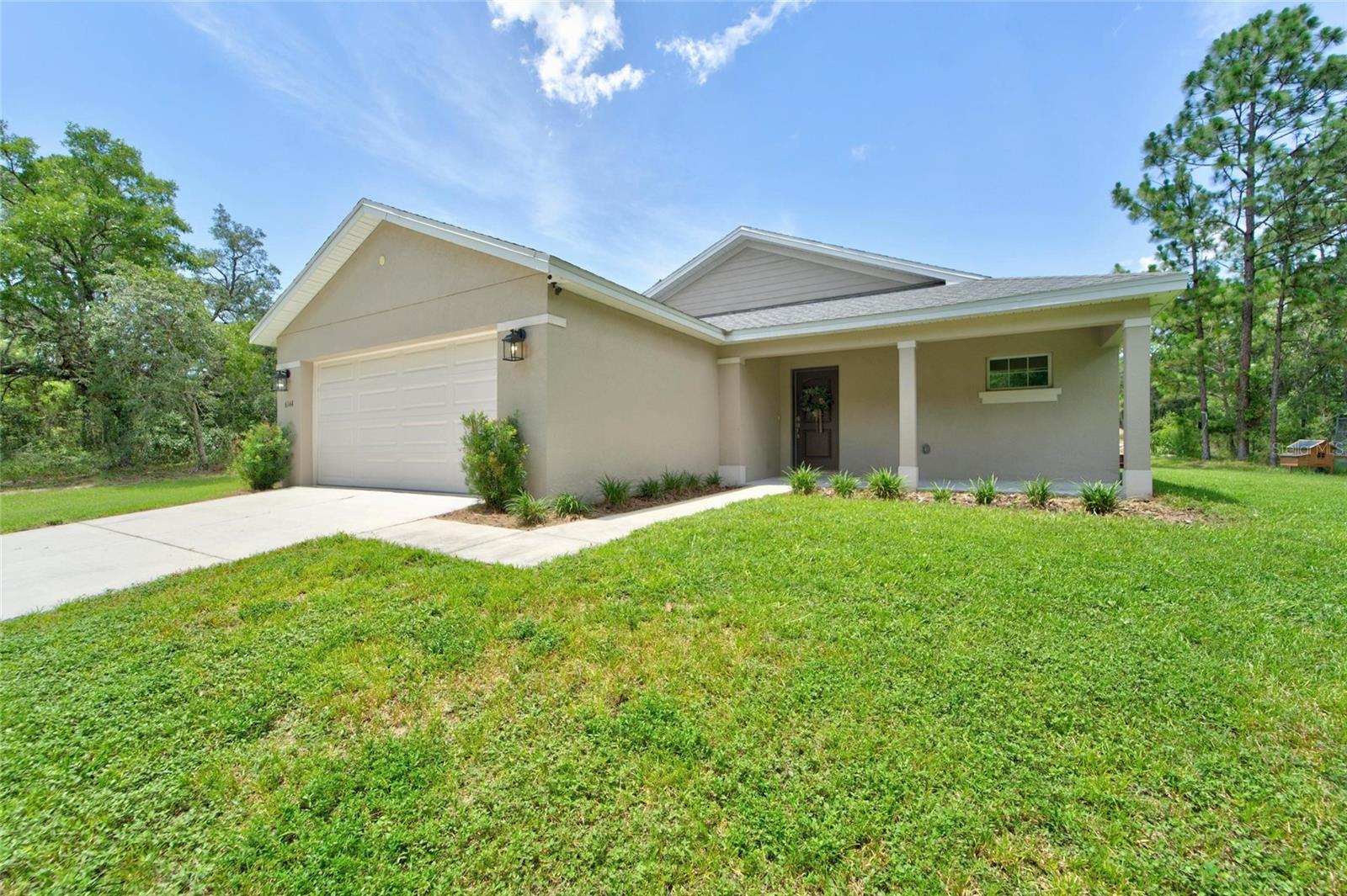Country Living at Its Best!
Welcome to your own slice of paradise! This beautiful 3-bedroom, 2-bathroom home offers 1,341 square feet of thoughtfully designed living space on a 1.25-acre homesite with no HOA and no CDD fees.
Step inside to an open-concept floor plan featuring vaulted ceilings, creating a bright, airy and spacious feel. The main living areas are finished with durable tile flooring, while the bedrooms offer the comfort of carpet. The expansive great room flows seamlessly into the kitchen and opens to the rear patio - making it perfect for entertaining or simply relaxing in your peaceful country setting.
The kitchen is the heart of the home, showcasing granite countertops, stainless steel appliances, and an oversized island with breakfast bar seating and an abundant cabinet storage with upgraded hardware. Designed for both function and style, it offers everything you need for everyday living and hosting gatherings with ease. A dedicated utility room includes a washer and dryer for added convenience.  .
The primary suite features a walk-in closet and a private ensuite with dual sink granite vanities, a tiled walk-in shower, and a separate water closet for added privacy. The home features two additional bedrooms, both generously sized and each offering its own storge closet, providing flexible space for guests, family, a home office or hobby rooms. The second full bathroom, serving the additional bedrooms, includes granite vanity and a tub/shower combination. Granite countertops and comfort-height vanities continue in this bathroom, adding style and functionality.
 
Enjoy peaceful mornings on the covered front porch overlooking the serene countryside or spend your evenings on your back patio in your private backyard oasis. With 1.25 acres, there’s plenty of space to bring your RV, boat, ATVs, and all your outdoor toys—there's plenty of room to spread out and enjoy country living.
Additional features include a 2-car garage, poured concrete driveway, and a privately built shooting range that the owner states was constructed to comply with applicable requirements.
If you've been searching for a newer home with modern finishes, exceptional storage, privacy, and room to live the lifestyle you want, this is the one. Schedule your private showing today!