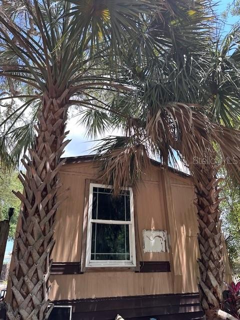 This 1972, 2 bed - 2 bath, 784 sq foot mobile home is NOT in a mobile home park.  The interior is yours to design. The single wide is located on its owned land (86' x 60') with a fence located within the City of New Port Richey.  NO HOA - NO FLOOD - LOW TAXES - NO DEED RESTRICTIONS - NO CDD. Park commercial vehicles, recreation water toys, etc on the lot behind a fence. Seller has removed most of the debris leaving a shell of a mobile home with some stud walls.  Stable flooring, new aluminum (galvanized) exterior panels have been placed around the complete mobile home with appx 21x8 metal panels. This mobile home is ready for your interior build.  Create your own interior with your desired flooring, appliances, color, etc. Trash is paid annually via taxes. Vacant lot next door. Don't miss out on this opportunity to make this mobile your new home.   Take advantage of retail shopping & restaurants nearby. West Pasco Little League field is nearby. The Gulf of America along with many beaches are at your fingertips.  A newer VA Outpatient hospital is nearby.  MacDill Air Force Base, Busch Gardens, and Tampa (TIA) Airport are appx 36 miles away and St Pete/Clearwater (PIE) Airport are appx 27 miles away.  Two new leading edge technology centers are in West Pasco: The Moffitt Cancer Center at SPEROS is a world-class state of the art facility with an expansion campus in Land O Lakes (Pasco County) and Richard M Schulze Family Foundation Proton Center (a therapy system) will be opening in the spring of 2026. Pasco County grants easy access to anywhere in central Florida. Your playground awaits!
