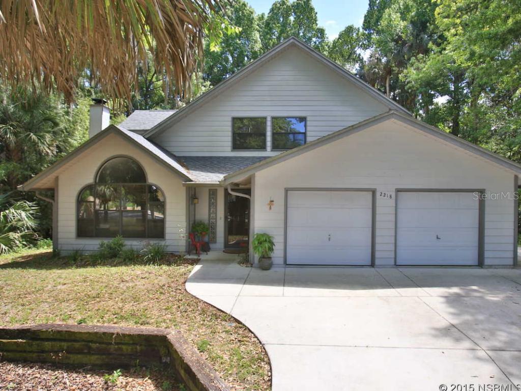 Wonderful family home located in a private, wooded setting in a desirable neighborhood.  Three bedrooms with a possible 4th now used as a sitting roof/office. Open plan downstairs with downstairs master. Screened porch leads to circular hot tub for relaxing and a private back yard.  Wood flooring, gas fireplace and updates throughout make this home perfection.  Additional lot conveys with purchase.  Can remain with home or possibly be developed. ;Water: City