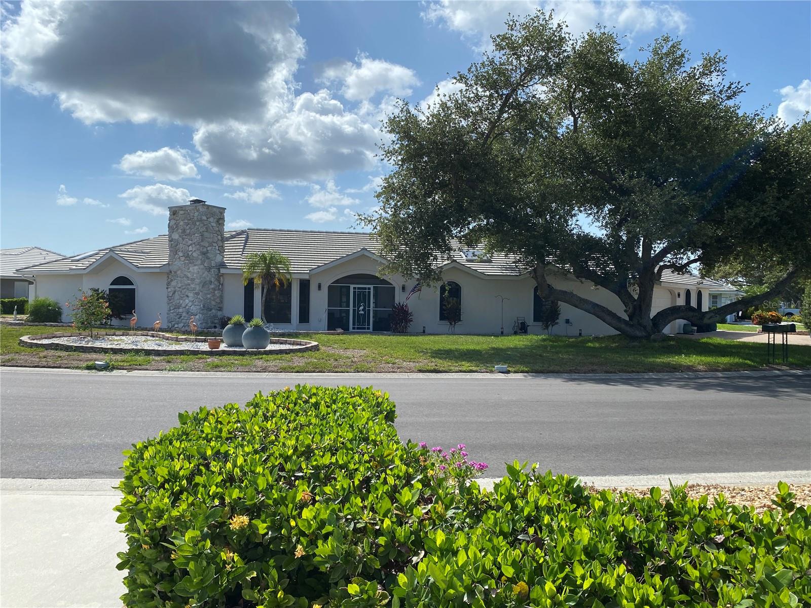 Situated on picturesque Eden Lake in the Englewood Isles Community this delightful completely renovated and updated 4 bedroom 3 bath 4 car garage offering a coastal design with a large open split floor plan. This unique property rambles around an oversized corner lot. New tile roof (2023), updated pool and deck (2023), new A/Cs (2021/2025).Also an impressive garage anyone would find amazing, garage cabinets are included. Englewood isles features its own marina with boat slips available for rent/lease with no fixed bridges to the gulf.  All this is located near the historic downtown Englewood, downtown Venice, local beaches and so much more.