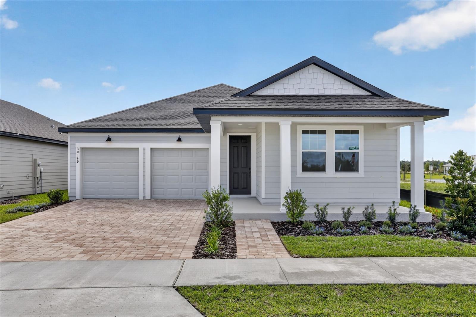 Discover Florida living in this beautifully designed Douglas II home, located in the desirable Trailside community of Mount Dora. This single-story residence offers 3 bedrooms, 2 baths, and a 2-car garage, thoughtfully crafted for comfort and modern style. The open-concept floor plan is filled with natural light and features 42" neutral-toned cabinets, stainless steel appliances, and a large island with upgraded quartz countertops, making the kitchen ideal for both everyday living and entertaining. Wood-look luxury vinyl plank flooring enhances the main living areas, while the bedrooms feature upgraded carpet for added comfort. Design finishes feature the AW Collection Foundry offering vintage yet modern style. Residents of Trailside enjoy access to community amenities including a resort-style pool, clubhouse, and playground. Ideally situated near top-rated schools and just minutes from the charming shops and restaurants of historic downtown Mount Dora, this home offers the perfect blend of convenience, style, and community living.