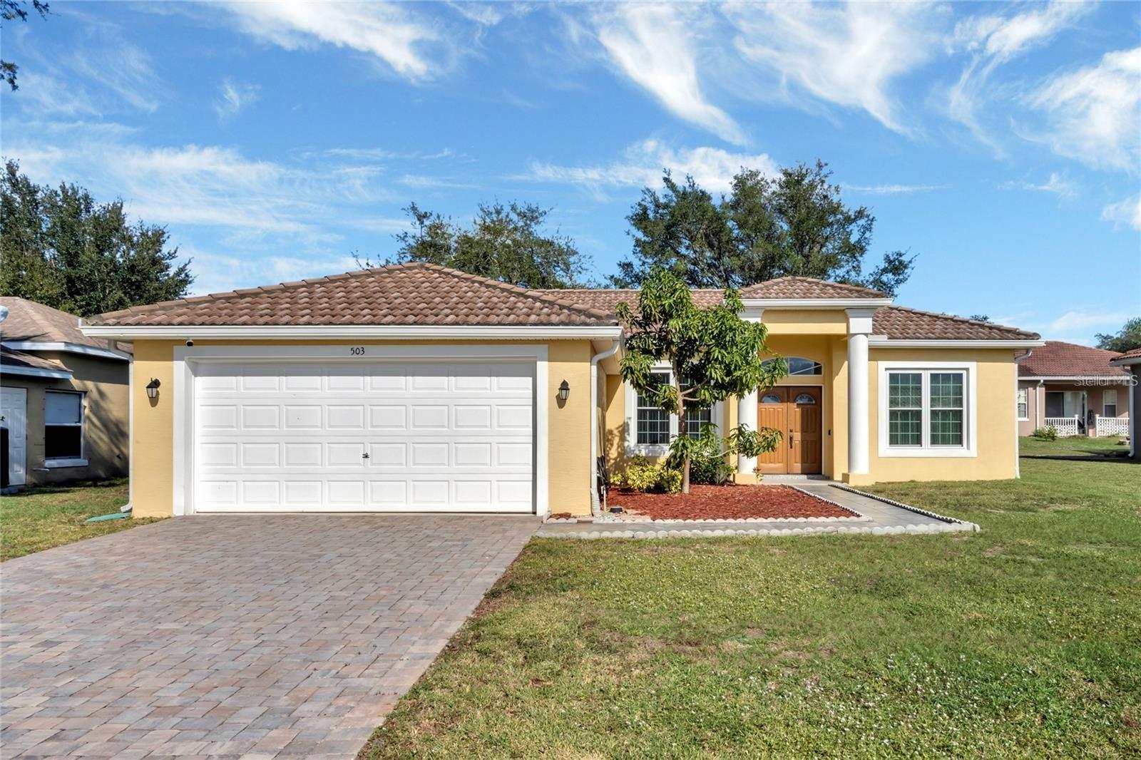 Short Sale. MOVE-IN READY! This impeccably maintained, solid-block 3-bedroom, 2-bathroom, 2-car garage home in Poinciana features a highly desirable split floor plan and a grand double-door entrance leading into bright spaces with soaring high ceilings. The interior boasts easy-care tile flooring throughout all common areas and the master suite, a spacious living/dining room combo, and an upgraded kitchen equipped with elegant granite countertops, a breakfast bar, and a cozy dinette. The private master retreat offers dual sinks, a large walk-in closet, a linen closet, and an en-suite bath with updated cabinets and a sliding glass shower door. Major high-ticket updates provide ultimate peace of mind, including newer energy-efficient double-pane windows and a newer A/C system replaced on December 5, 2022. Water heater was replaced March, 2023 & The garage door motor was replace on April, 2026. Topped with its original tile roof, this home is situated in a fantastic Poinciana community just minutes from shopping centers, restaurants, medical offices, hospitals, banks, and parks. This incredible property truly must be seen to be fully appreciated; schedule your showing today! HOA includes: Cable and Internet! Listing price and sale are subject to third-party bank approval.