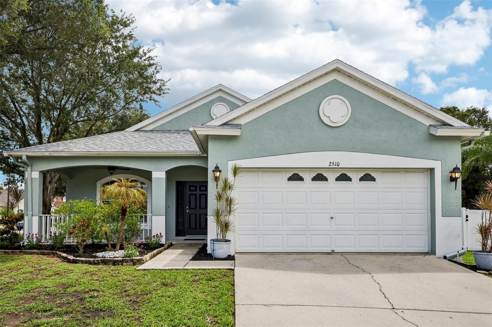 Virtually Staged. Welcome to this beautifully maintained 3-bedroom, 2-bath home nestled on a desirable corner cul-de-sac lot in the sought-after Suncoast Meadows community of Land O’ Lakes. From the moment you arrive, the charming curb appeal captures your attention with a spacious front porch, inviting you to relax and enjoy the welcoming atmosphere of this exceptional home. Inside, you’ll find a bright and open layout filled with natural light, elegant crown molding, and thoughtful details that create a warm and inviting feel throughout. The spacious living room provides the perfect setting for relaxing or entertaining and flows seamlessly into the kitchen and dining area. The kitchen is the heart of the home, featuring a large island, abundant cabinetry, generous counter space, and an open view of the dining area complete with built-in shelving and sliding glass doors leading to the backyard. The spacious bedrooms offer plenty of comfort, including the primary suite with a private en-suite bathroom featuring dual sinks and a tub/shower combination. Outside, the fully fenced backyard is designed for enjoying the Florida lifestyle with a paver patio and gazebo, creating the perfect space for gatherings, outdoor dining, or quiet evenings at home. Major updates include a NEW ROOF (2025) and NEW A/C (2026). Enjoy the incredible amenities of Suncoast Meadows, including a community pool, playground, dog park, and amenity center. Conveniently located near shopping, restaurants, grocery stores, golf courses, and major highways, this home offers the perfect blend of comfort, convenience, and community in Land O’ Lakes. Mortgage savings may be available for buyers of this listing.