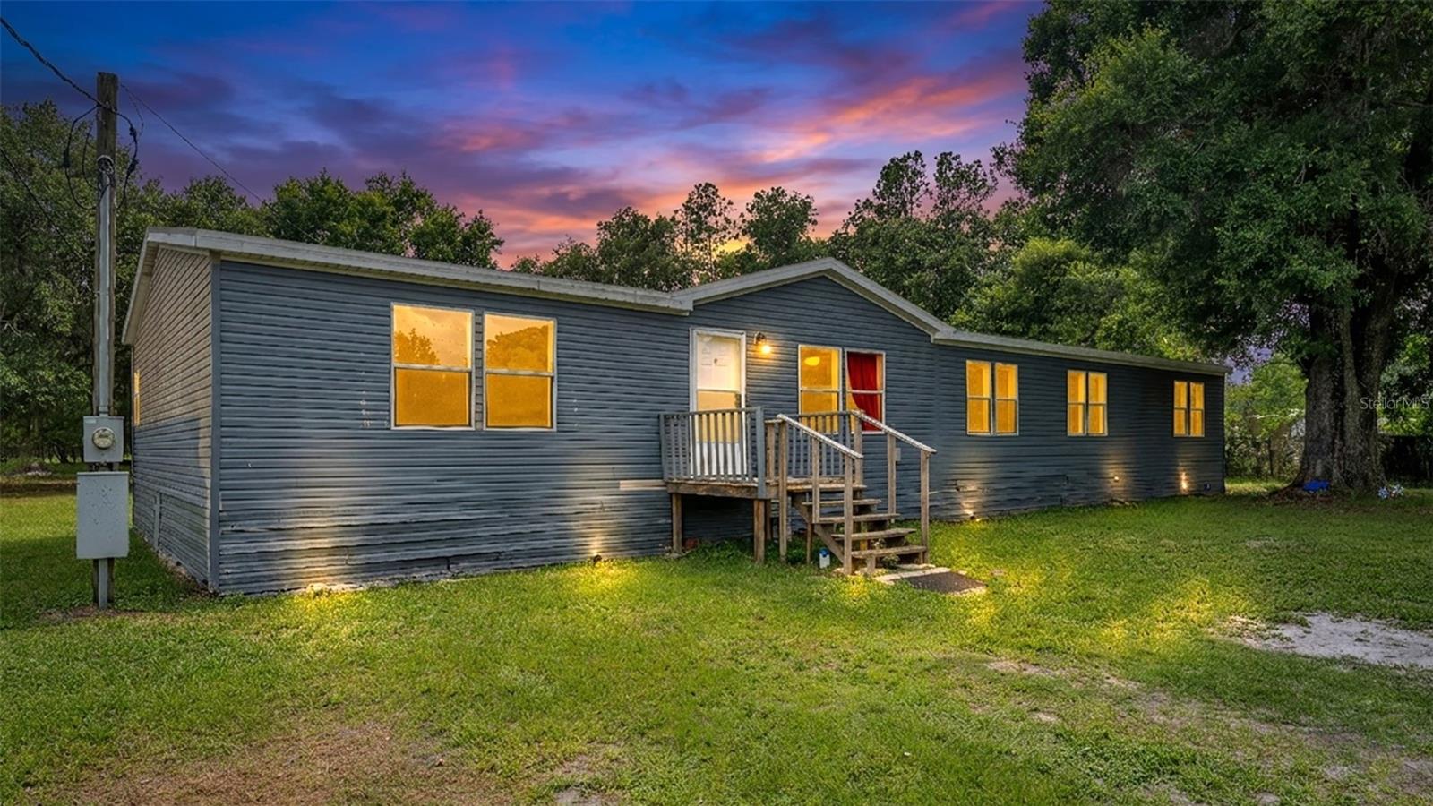 Looking for space, freedom, and a property you can truly make your own? This 5-bedroom, 2-bath manufactured home sits on just over 1 acre in North Lakeland with no HOA and plenty of room to spread out. The home offers a functional layout, a new roof installed in 2025, an A/C system less than 10 years old, and a water filtration system.

Outside, you'll find a large covered area with electrical already in place, providing endless possibilities for storage, hobbies, a workshop, or entertaining space. The property does need some TLC, making it a great opportunity for buyers looking to add their personal touch and build equity.

Conveniently located with easy access to shopping, dining, and major roadways while still offering the space and privacy that acreage living provides. If you've been searching for a property with potential and room to grow, this could be the one.