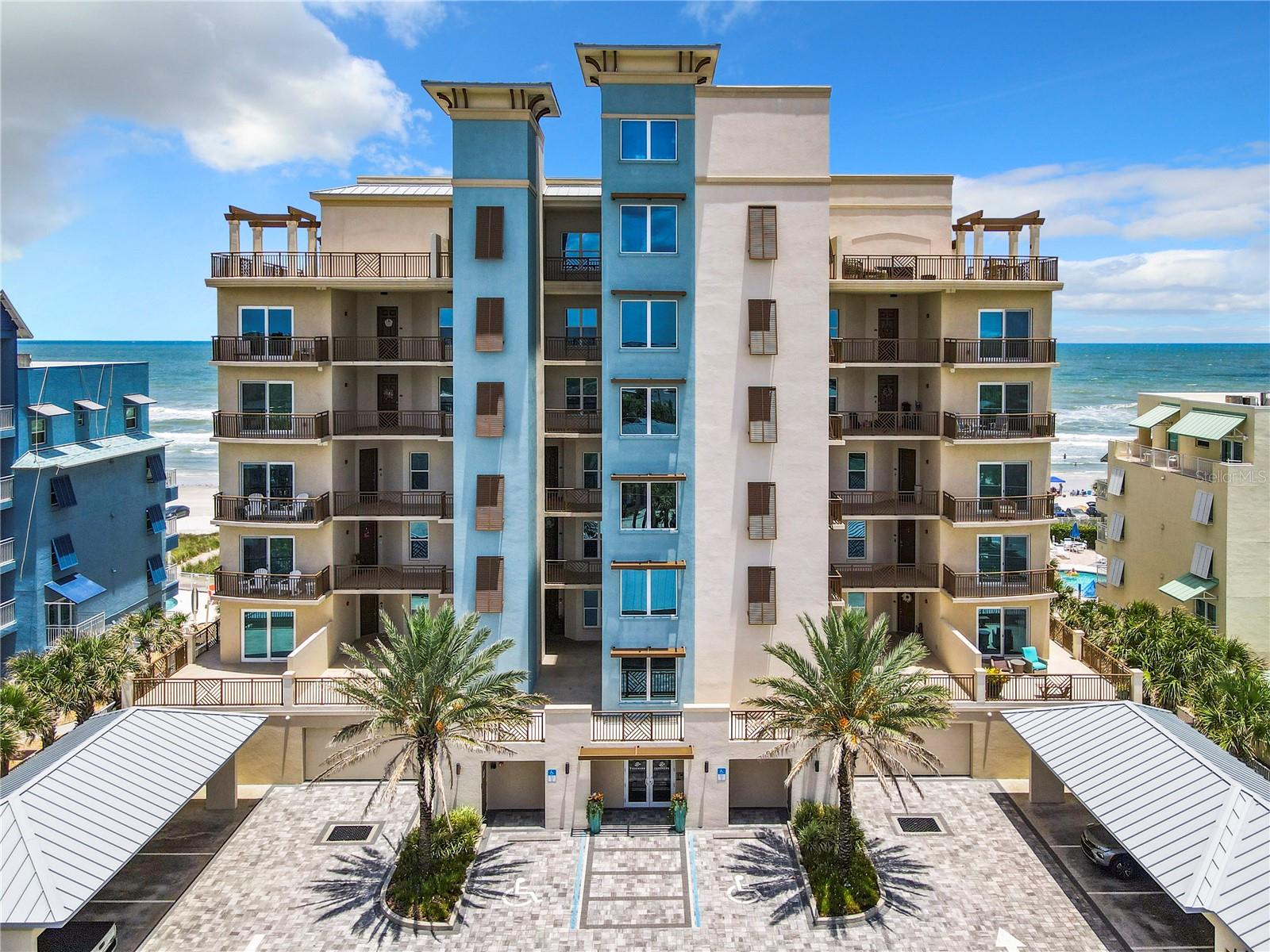 BUILT IN 2019! STRUCTUAL INTEGRITY RESERVE ACCOUNT FULLY FUNDED! ONLY 19 UNITS! Discover boutique oceanfront living at its finest in this rarely available 3-bedroom, 3-bath residence at TYDEMARK, a New Smyrna Beach gem. With just 19 residences and a fully funded Structural Integrity Reserve Account, this exceptional community offers luxury, exclusivity, and long-term peace of mind.
Step inside and be captivated by sweeping Atlantic Ocean views framed by oversized hurricane-impact doors and windows. The open-concept design seamlessly unites the living, dining, and gourmet kitchen, creating the perfect setting for entertaining or relaxing by the sea. Every detail whispers luxury with custom cabinetry, tray ceilings, premium quartz countertops, and designer fixtures that elevate the coastal aesthetic. Your oceanfront primary retreat features a spa-inspired ensuite with dual vanities, a walk-in shower, and an oversized window to breathtaking ocean views. Two additional bedrooms provide privacy and comfort for family and guests.
Step onto your private balcony to greet the sunrise with your morning coffee or unwind in the evening with cocktails as the waves roll onto the shore below. Life at TYDEMARK extends far beyond your front door. Enjoy a resort-style beachfront pool, ocean-view fitness center, beautifully appointed clubhouse suite for private gatherings, secure underground parking, and covered parking for a second vehicle.
Best of all, you're just steps from Flagler Avenue, where boutique shopping, art galleries, exceptional dining, and the vibrant charm of New Smyrna Beach await. Don't miss this rare opportunity to own one of the area's most exclusive oceanfront residences and make this coastal dream your reality!
