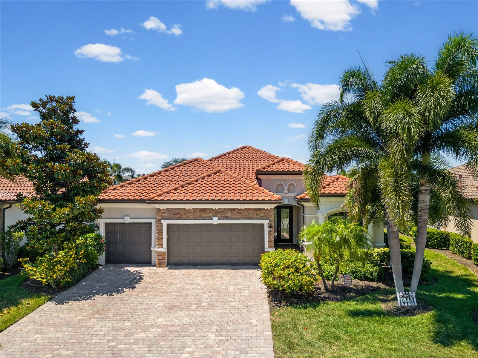 Welcome to this exceptional Lennar-built Princeton model in the highly sought-after Bridgewater at Lakewood Ranch community. Perfectly positioned on a premium homesite, this stunning 4-bedroom, 2-bath home with a 3-car garage with a whole home generator system, offers an ideal blend of luxury, comfort, and breathtaking views.
The home’s desirable southern front exposure overlooks the community park and playground, while the northern rear exposure captures peaceful lake views from the back. Inside, luxurious upgrades and designer finishes are showcased throughout, including custom mirrors in the dining room and breakfast nook, elegant tray ceilings, crown molding, decorative wall trim and accents, and a stylish electric fireplace in the dining area.
The gourmet kitchen is beautifully appointed with a large island, granite countertops, and a quartz backsplash, creating a perfect space for entertaining and everyday living. The spacious owner’s suite features an oversized shower, soaking tub, and serene water views.
The open-concept living area is filled with natural light and seamlessly connects to the expansive lanai through sliding glass doors, revealing a heated pool and spa with tranquil lakefront scenery. Whether enjoying morning coffee in the breakfast nook or relaxing poolside, you’ll appreciate the peaceful setting from every angle.
Residents of Bridgewater at Lakewood Ranch enjoy walking paths, a lakeside pavilion, playgrounds, and convenient access to golf courses, fitness centers, the YMCA, shopping, dining, medical facilities, and top-rated schools. The New Lakewood Ranch Library and New Aquatic Center are less than a mile away. Located just minutes from University Town Center and a short drive to Florida’s award-winning Gulf Coast beaches, this home truly offers the best of the Florida lifestyle.