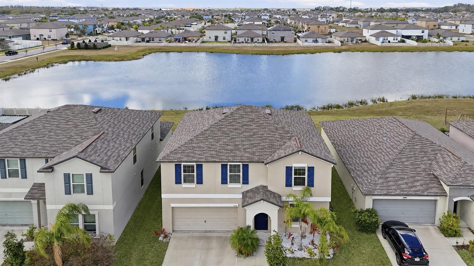 Welcome to a spacious newer-build home in Cypress Mill that checks all the boxes , 4 bedrooms, 2.5 bathrooms, a dedicated office/flex space, spacious loft, and a large waterfront lot with beautiful pond views.

The first floor offers an open-concept layout designed for everyday living and entertaining, with the kitchen flowing easily into the main living area. The kitchen features a center island with breakfast bar seating, pantry, and dining space, creating a bright and functional heart of the home. A separate formal dining room provides added flexibility and can easily serve as a private home office, playroom, or additional flex space.

Upstairs, the generous primary suite includes an en-suite bathroom with dual vanity and a large walk-in closet. Three additional bedrooms, a full bathroom, a spacious loft/bonus room, and the laundry room are also conveniently located on the second floor. The loft is perfect for a second living area, game room, media space, or homework zone.

Step outside and enjoy peaceful water views from the large backyard, offering plenty of room to play, garden, entertain, or create your dream outdoor retreat.

Cypress Mill offers a vibrant community lifestyle with amenities including a clubhouse, fitness center, resort-style pool, splash pad, playground, pickleball courts, tennis courts, and more. Conveniently located close to I-75 and just minutes from shopping, dining, and easy access to Tampa, this home delivers the space, flexibility, location, and lifestyle buyers are looking for.