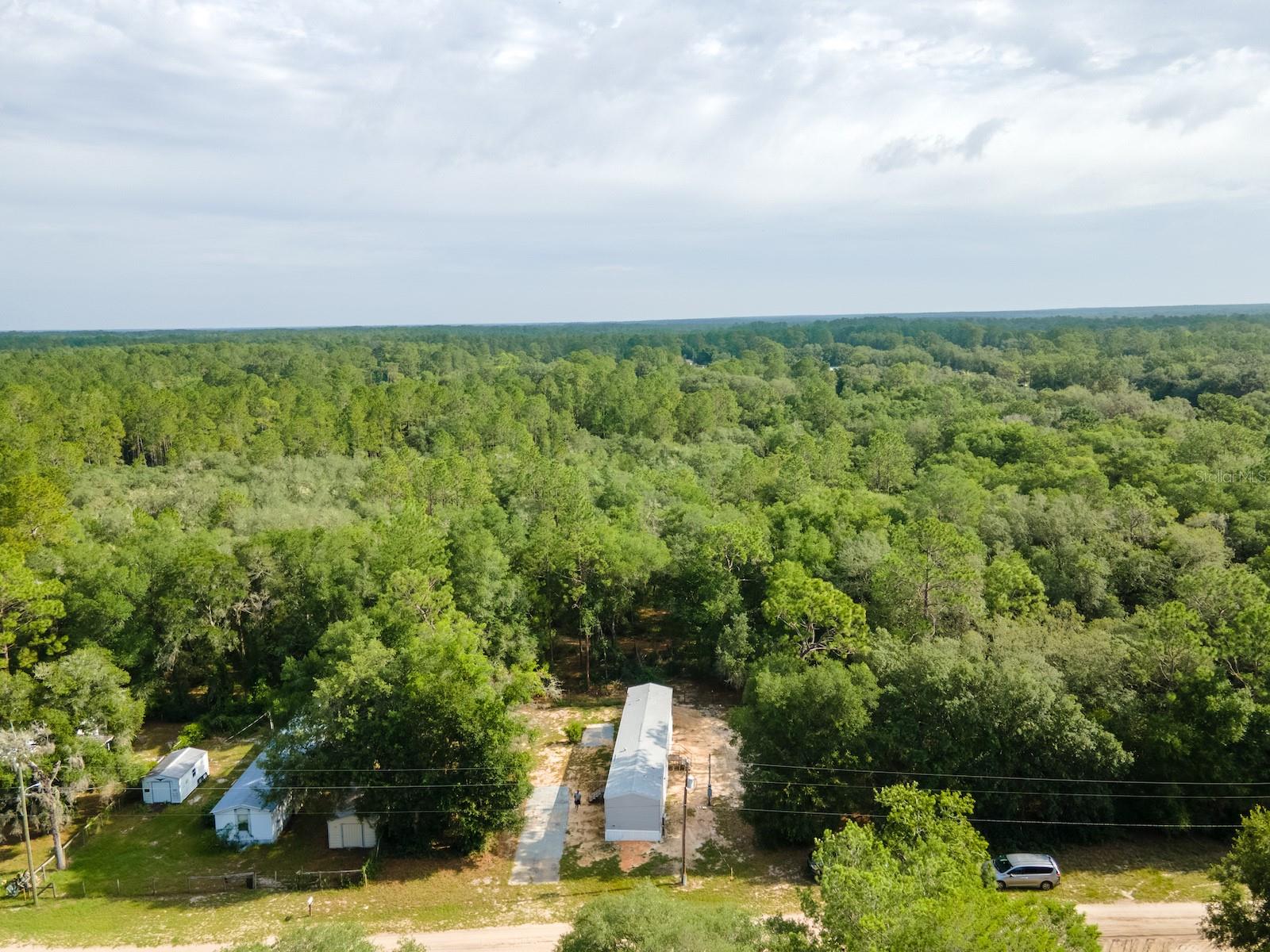 2024 Move-In Ready Home Near the Ocklawaha River

14585 NE 149 Lane, Fort McCoy, FL 32134
3 Bedrooms | 2 Bathrooms | 2024 | Fire Sprinkler System

Welcome home to this beautifully maintained 2024-built residence, offering modern construction, low-maintenance living, and an outstanding location for enjoying everything North Central Florida has to offer. Whether you're a first-time homebuyer, looking to downsize, or searching for a smart investment opportunity, this home is ready to impress.

The exterior is modest and easy to maintain, while the interior is clean, and move-in ready with a neutral color palette that provides the perfect canvas to make it your own. Durable vinyl flooring throughout offers both style and easy upkeep, and the thoughtfully designed floor plan features 3 bedrooms and 2 full bathrooms making excellent use of every square foot. Home is 100% accessible including wide doorways & hallway, bathroom features and cabinet design(currently no wheelchair ramp outside but could be added).   

The open-concept living area creates a comfortable space for relaxing or entertaining, while the kitchen flows seamlessly into the main living area for everyday convenience. The home's modern finishes, furnishings(inlcuded) and well-maintained condition allow you to move right in while adding your own personal touches over time.

One of the home's standout features is the built-in fire sprinkler system, a valuable safety feature that may also help reduce homeowner's insurance costs. The property was deeded in 2024, adding to the appeal of this nearly new home.

Outdoor enthusiasts will appreciate the location just minutes from Eureka East and Eureka West Recreation Areas, offering public boat ramps, fishing piers, swimming, and easy access to the beautiful Ocklawaha River.

Conveniently located only 10 minutes from downtown Fort McCoy, you'll have quick access to grocery stores, restaurants, pharmacy, hardware, gas stations, and everyday necessities. Silver Springs is just a short drive away for shopping, Walmart, Lowe's, restaurants, and entertainment, while Ocala is only another 10 minutes beyond. Gainesville is approximately 50 minutes away.

Nature lovers will appreciate being surrounded by the incredible recreation opportunities of the Ocala National Forest, with nearby Salt Springs, Silver Glen Springs, Juniper Springs, miles of hiking and horseback trails, kayaking, canoeing, fishing, hunting, and off-road adventures all within easy reach.

Affordable, nearly new, and move-in ready, this home offers an excellent opportunity to enjoy the Florida lifestyle in a growing area.

Schedule your private showing today!