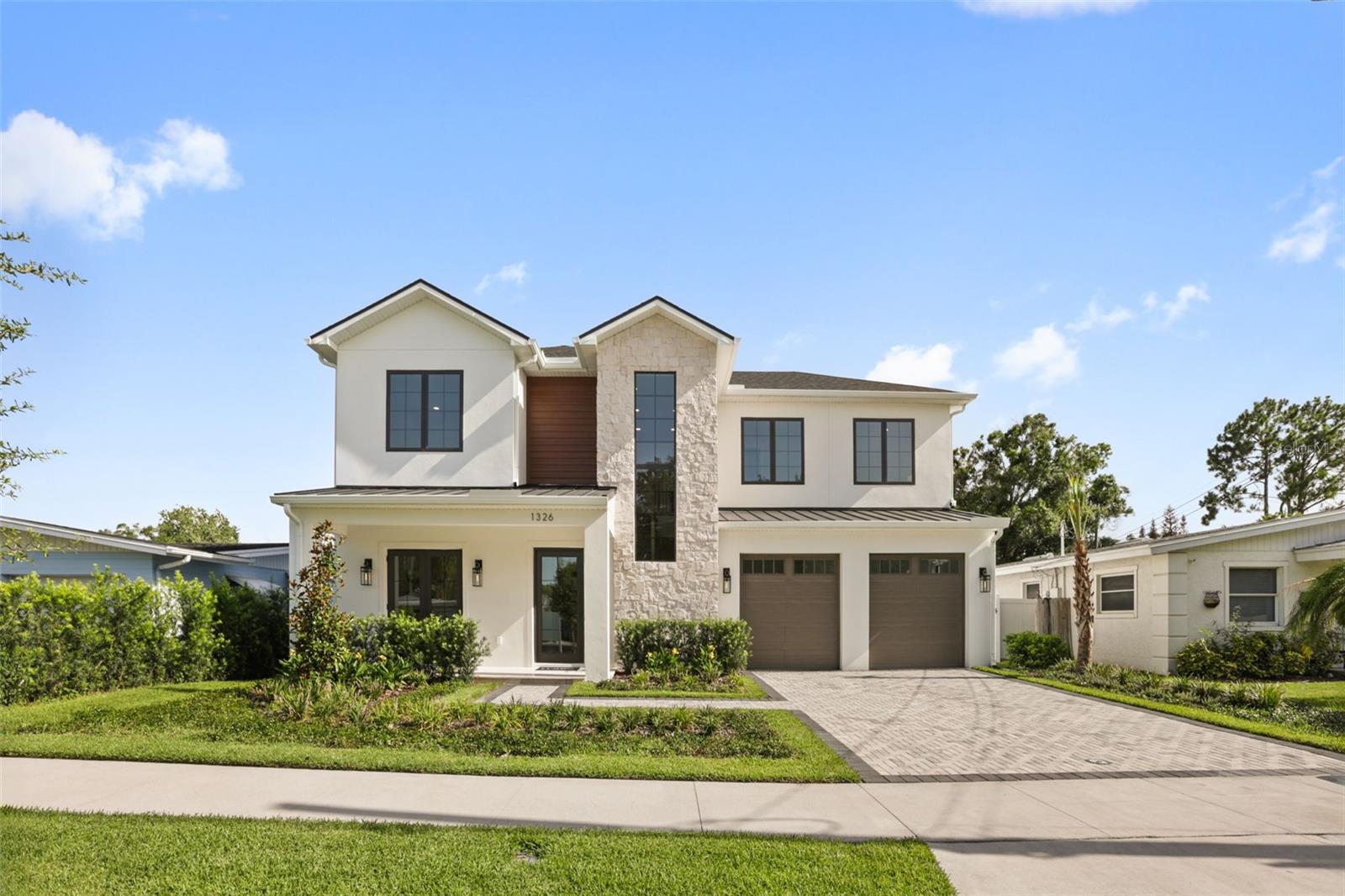 Perfectly positioned in the highly coveted enclave of College Park, this custom-designed transitional masterpiece by LUIH Luxury Homes redefines modern Orlando luxury. This expansive residence spans nearly 3,500 square feet of intelligent design, uncompromising construction, and impeccably refined finishes. Upon entry, exquisite engineered wood and porcelain tile flooring establish an immediate atmosphere of warmth and sophistication. At the heart of the home, a state-of-the-art chef's kitchen—outfitted with elite Thermador appliances, a 36-inch gas range, a bespoke pot filler, and a dedicated wine cooler—seamlessly integrates with the expansive, open-concept living and dining spaces. Designed for unrivaled comfort and elite entertaining, the kitchen and living areas flow effortlessly outward to a lanai, fully equipped summer kitchen, sparkling saltwater pool and lush landscaping creating an unparalleled setting for seamless indoor-outdoor living. The ground-floor primary suite serves as a private sanctuary with direct access to the backyard, evoking a spa-like retreat with elegant details and a lavish en-suite bathroom designed to ensure absolute tranquility. Ascend upstairs to an oversized loft space complemented by three additional bedrooms. Enjoy the luxury of a brand-new home in a well-established pocket of College Park, along with the unparalleled convenience of being just minutes from Winter Park’s Park Avenue, Downtown Orlando, the Dr. Phillips Performing Arts Center, and the Medical District. Offering effortless access to airports and major freeways while maintaining absolute serenity, this is truly luxury living at its finest.