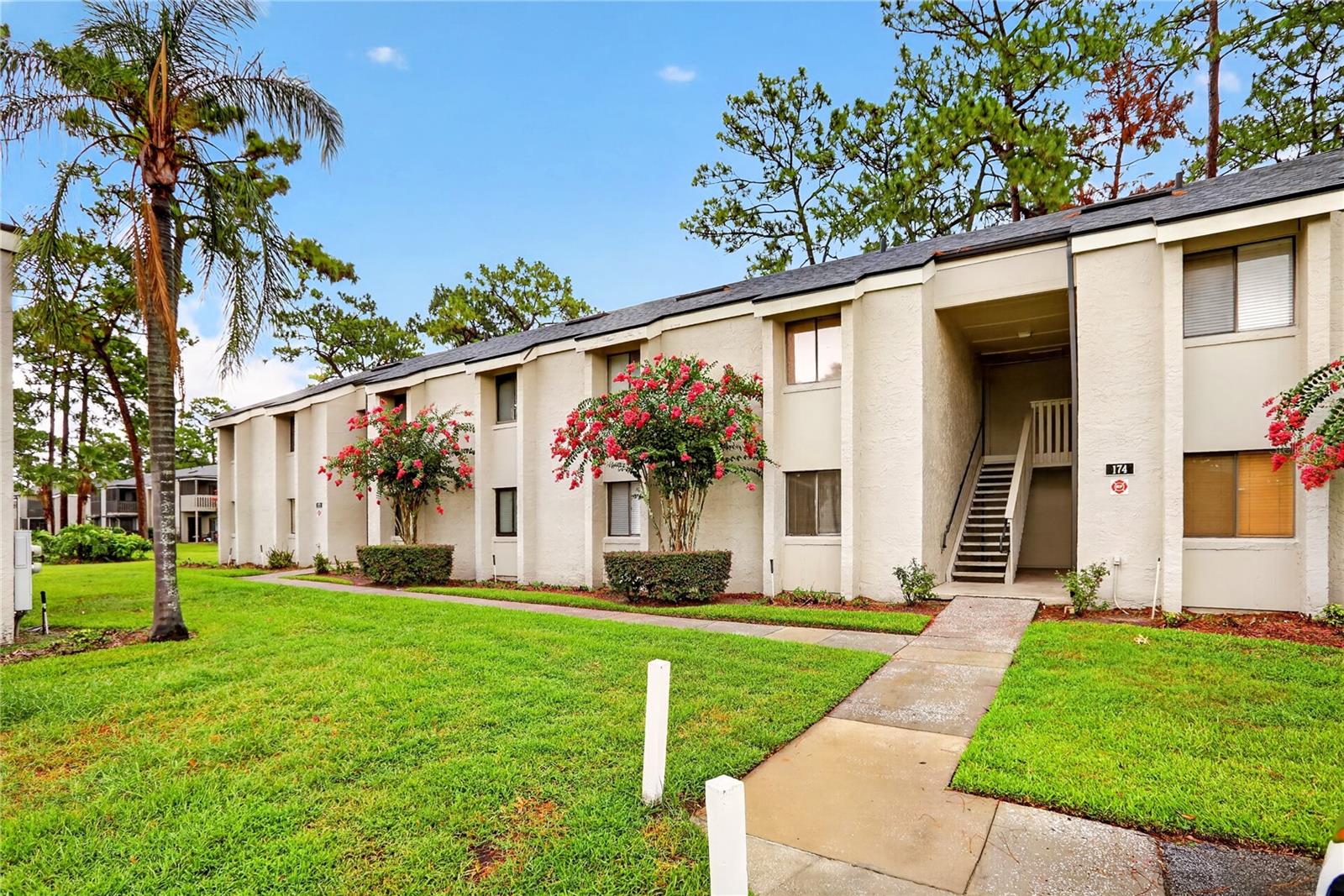 Welcome home to this charming, move-in-ready condo nestled in a peaceful setting with beautiful wooded views. Relax on the screened porch while enjoying the sights and sounds of nature, creating the perfect retreat from the hustle and bustle of everyday life.

Inside, you'll find an open and inviting floor plan featuring crown molding throughout, bamboo laminate flooring in the main living areas and tile flooring in both bathrooms. The updated kitchen and bathrooms showcase attractive Corian countertops, while the spacious living and dining areas flow seamlessly into the kitchen—ideal for both everyday living and entertaining.

A rare and highly desirable feature is the inside laundry closet with space for a full-size washer and dryer, a convenience not found in many units. The kitchen also offers a separate dining area, and sliding glass doors in living room provide abundant natural light and peaceful views of the wooded backdrop. Additional storage is available in the exterior patio storage closet.

Recent updates completed by the seller include a newer A/C system, water heater, refrigerator, garbage disposal, washer and dryer, and added attic insulation for improved energy efficiency. New Roof installed by HOA Feb.2022.

Conveniently located near I-4, shopping, dining, entertainment, and major roadways, this community offers easy road access to area attractions, beaches, and everything Central Florida has to offer.

Don't miss this wonderful opportunity—schedule your private showing today!