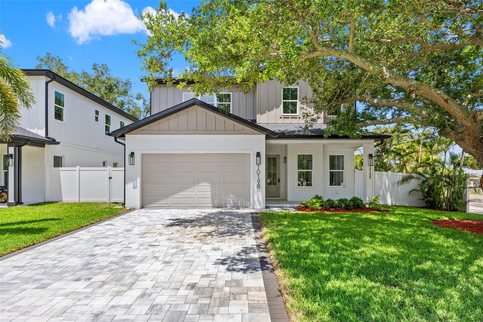 Welcome to The Palms of Seminole, an exclusive new-construction enclave of six homes featuring contemporary coastal design just 2 miles from the beach. This 4-bedroom, 3-bath residence blends elevated style with everyday comfort and convenience. Step inside to find luxury finishes throughout, including an open-concept layout, designer lighting, and impact-rated windows that require no hurricane coverings. The gourmet kitchen is a showpiece, equipped with a Samsung Bespoke appliance package, sleek cabinetry, and quartz countertops, perfect for entertaining or quiet nights in. The spacious primary suite offers a serene retreat, while the spa-inspired bathrooms showcase premium tile work and elegant fixtures. Outside, enjoy your private paver driveway, 2-car garage, and professionally landscaped yard with irrigation in front in back (including a well and pump for irrigation- no high water bills) and an in-wall pest control system for low-maintenance living. With no HOA, no CDD, and no flood insurance required, you’ll have the freedom to live the Florida lifestyle without compromise- just minutes from world-class beaches, dining, and shopping. *Some photos may be of other homes that are also available at the Palms of Seminole. There are 6 homes and 2 different models to choose from. Each home has different finishes and color selections.