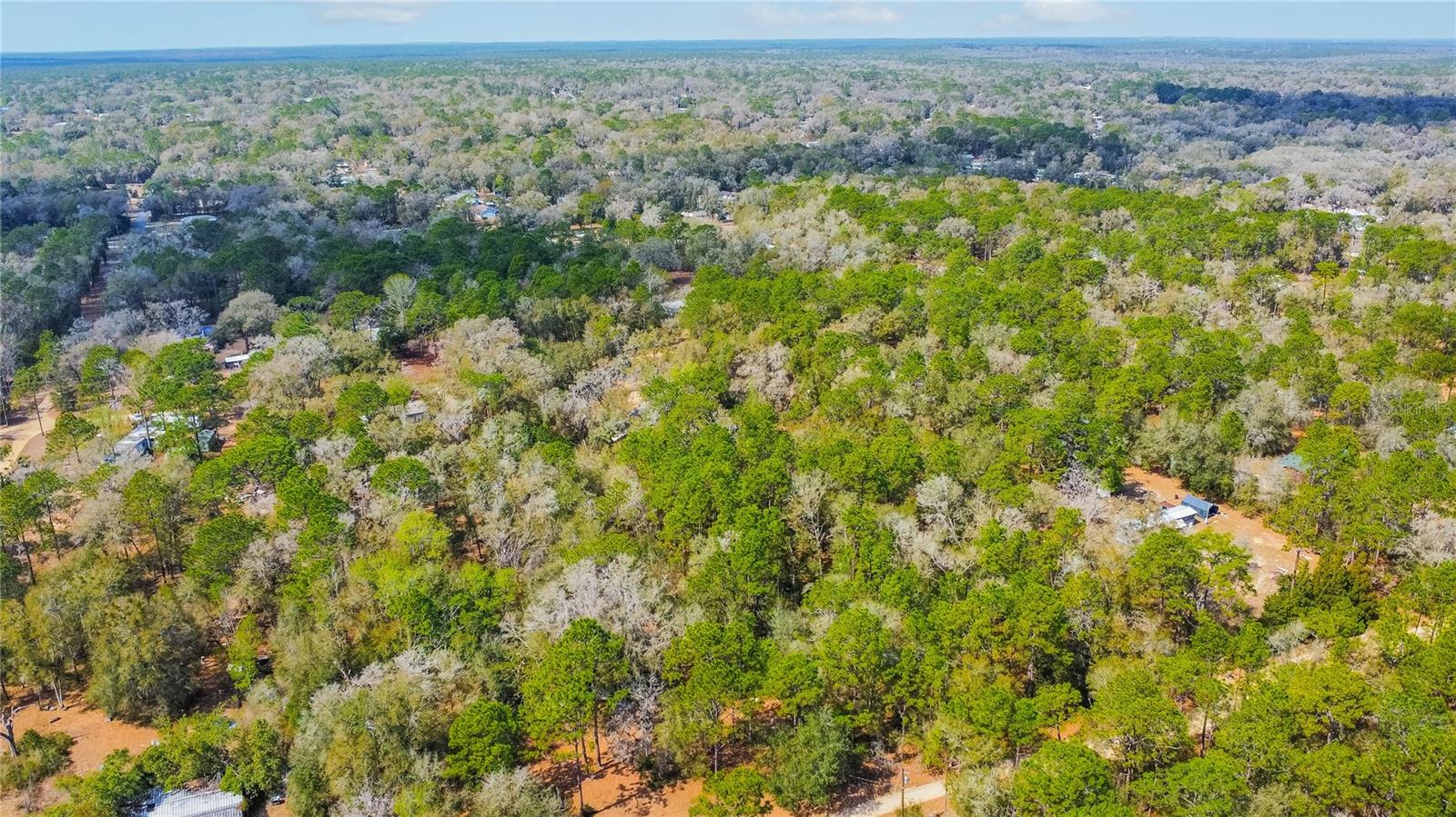Looking for a little elbow room and a lot of fresh air? Welcome to 5500 S Cherokee Ter in Inverness, where 1.30 acres of wooded Florida charm are waiting for you. Zoned LDRMH so yes, mobile homes are welcome. Bring the plans, bring the porch swing, and bring the chickens, if that’s your vibe. Tucked away on a dirt road for that peaceful, off the beaten path feel, this property offers the kind of privacy you just cannot fake. Towering pines, natural shade and plenty of space to carve out your perfect homesite. Country feel, room to roam and no cookie cutter vibes here. Come claim your slice of Citrus County and make it yours.
