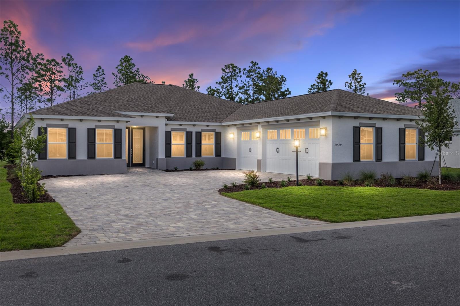 Enjoy privacy, space, and elegant design in this brand-new Northampton model located in Longleaf Ridge at On Top of the World. Backing to no rear neighbors, this thoughtfully crafted home offers 3 bedrooms, 2 bathrooms, a spacious 3-car garage, and a flexible layout designed for both relaxation and entertaining.

A striking double-door front entry welcomes you into a bright and open interior where the great room serves as the centerpiece of the home. The seamless flow between the living area, kitchen, and breakfast nook creates an inviting atmosphere for everyday living and gatherings alike.

This floor plan stands out with both a dedicated library and a versatile flex room with French doors, offering endless possibilities for a home office, media room, hobby space, or quiet retreat. The owner's suite provides a peaceful escape with a private bath and generous closet space, while two additional bedrooms comfortably accommodate family or guests.

Additional highlights include a dedicated laundry suite, abundant storage, and the convenience of a 3-car garage. With no rear neighbors, you can enjoy added tranquility and outdoor privacy. Experience the best of new construction living in one of Ocala's premier active-adult communities, complete with world-class amenities and a vibrant golf cart lifestyle.