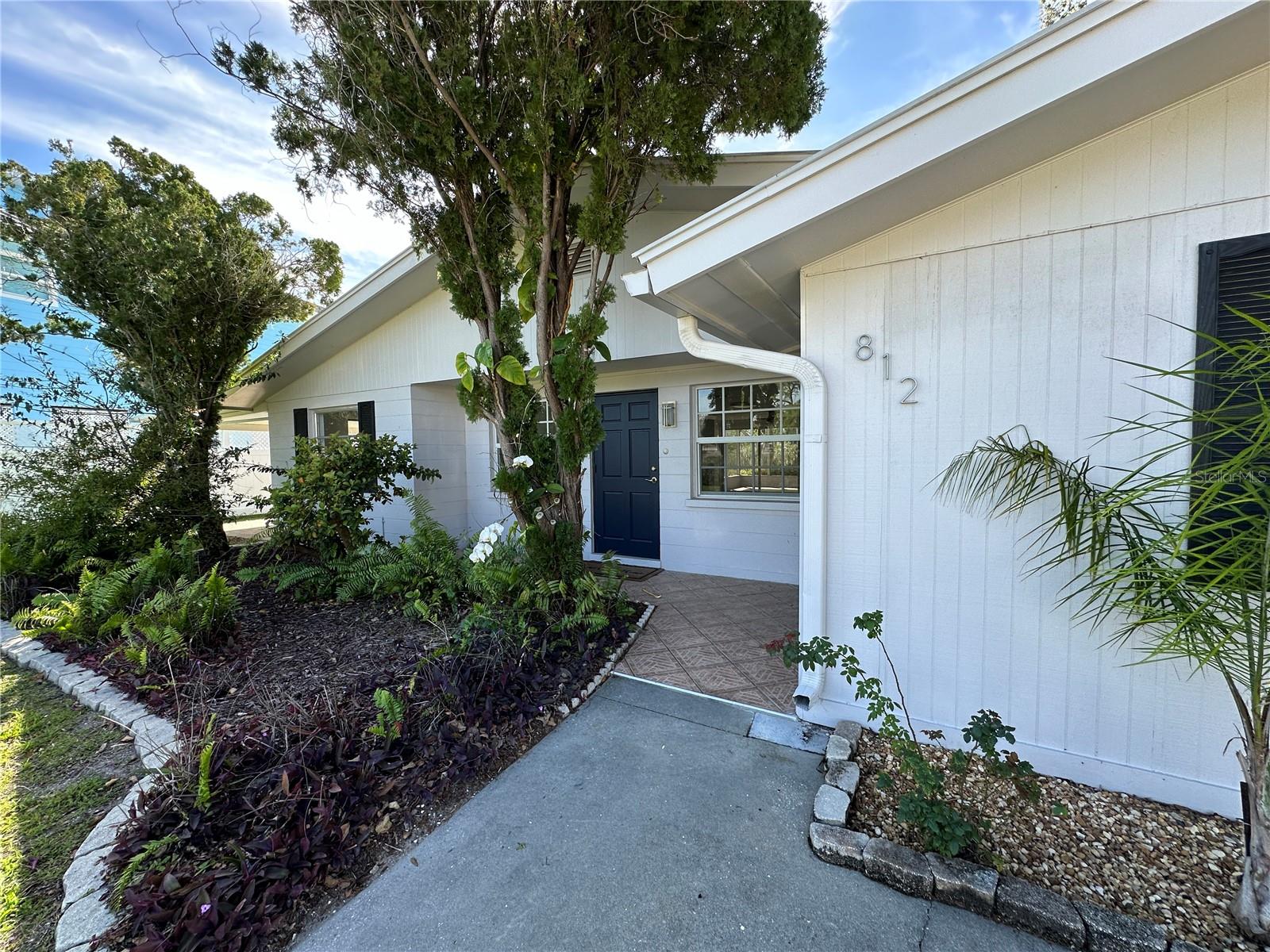 Old Florida living - Updated! Just 1.5 miles to the new SMH facility! Great school districts! Conveniently located between I-75 and US 41 and minutes to beaches, restaurants, grocery, and retail. This remodeled home boasts a split floor plan with three spacious bedrooms and two full bathrooms, offering ample space for comfortable living. Split floor plan provides privacy to the primary bedroom with ensuite on one side and other 2 bedrooms on the other. Both bathrooms have been remodeled with porcelain tile, Quartz countertops, new vanities, and updated fixtures. The kitchen is equipped with newer stainless steel kitchen appliances, shaker cabinets and views of the water. Adjacent sliding glass doors lead to a fully screened patio onto the huge backyard with mature trees and a large concrete pad ideal for grilling. Lots of natural light shines through the entire home with soft white and gray accents. As a bonus, the community offers a boat ramp and the home provides an extended driveway and covered carport to conveniently park your water toys, making this an ideal home for those who enjoy water activities. Experience the best of Nokomis living at 812 Bayview Drive. (Dock on property not warranted or available for use).