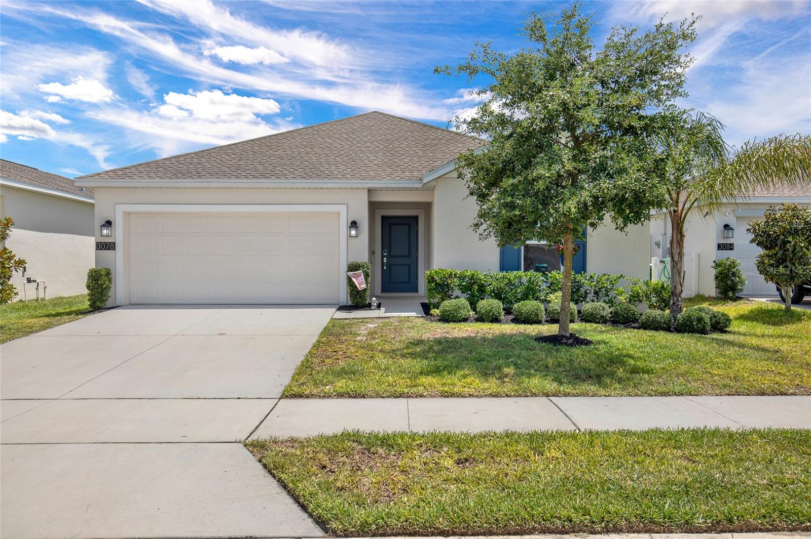 Built in 2023 this immaculately maintained 3-bedroom, 2-bath home with a spacious 2 car garage offers the perfect blend of comfort, convenience, and modern living in a family-friendly community.  As soon as you walk through the front door, you're greeted by a sense of openness and ease. Natural light pours into the main living area, highlighting the clean lines, neutral colors, and spacious layout that instantly make the home feel warm and welcoming.  Wood-plank tile flooring flows seamlessly through the main living areas and bathrooms, while the bedrooms feature upgraded carpet with premium padding for added warmth and comfort.  The heart of the home is the stunning kitchen with white cabinetry, stylish backsplash, stainless steel appliances, a large center island naturally drawing family and friends together. Whether it's morning coffee, helping with homework, or hosting holiday gatherings, the space feels designed for connection. The seamless flow between the kitchen, dining area, and living room creates an inviting atmosphere where everyone can be together while still enjoying plenty of room to spread out.

The split-bedroom layout provides privacy, while the generous primary suite offers a peaceful retreat featuring a large walk-in closet and a beautifully appointed ensuite bathroom with a glass shower enclosure, fully tiled shower and double vanity with solid surfaces.  Tucked away from the primary suite, Bedrooms 2 and 3 provide their own private wing of the home and feature ample closet space, abundant natural light, and flexible layouts that can easily accommodate children's rooms, guest quarters, a home office, hobby room, or fitness space.  The second full bathroom is located between the two bedrooms and includes a tub shower combo with upgraded tile finishes and solid surface vanity.  

Perfectly positioned between Orlando and Daytona Beach, and just minutes from SR-415, Florida's beautiful beaches, nature trails, shopping, dining, and everyday conveniences, this exceptional home offers more than just a place to live...it offers a lifestyle. Located adjacent to Volusia County's only vineyard and the historic Pell Nursery, you'll enjoy a unique blend of small-town charm, modern convenience, and Florida living at its finest. NO FLOODZONE

Families will appreciate the welcoming community atmosphere, nearby schools, parks, playgrounds, and amenities that make this neighborhood an ideal place to put down roots and create lasting memories. Residents also enjoy access to resort-style community amenities, creating opportunities for recreation, relaxation, and connection with neighbors.

Impeccably maintained, thoughtfully upgraded, and priced to sell, this is a rare opportunity to own a like-new home without the wait of new construction. From the open-concept design and beautifully appointed kitchen to the spacious living areas and private owner's retreat, every detail has been crafted for comfortable everyday living.

Come see for yourself why so many families are choosing to call Osteen home...schedule your private showing today.